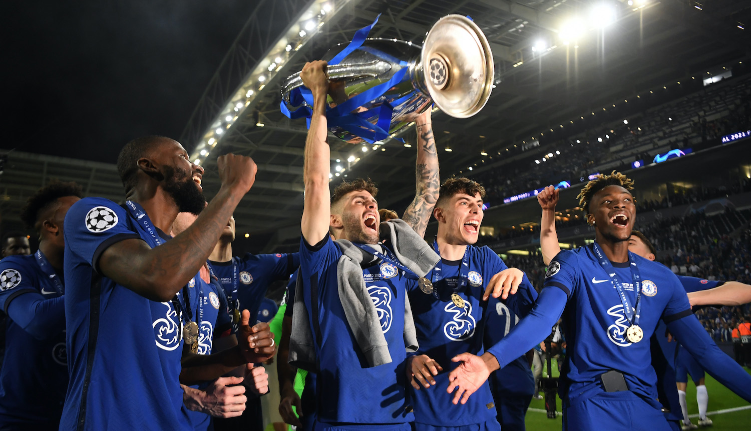PORTO, PORTUGAL - MAY 29: Christian Pulisic of Chelsea celebrates with the Champions League Trophy alongside teammates Antonio Ruediger, Kai Havertz and Tammy Abraham following their team's victory during the UEFA Champions League Final between Manchester City and Chelsea FC at Estadio do Dragao on May 29, 2021 in Porto, Portugal. (Photo by David Ramos/Getty Images)
