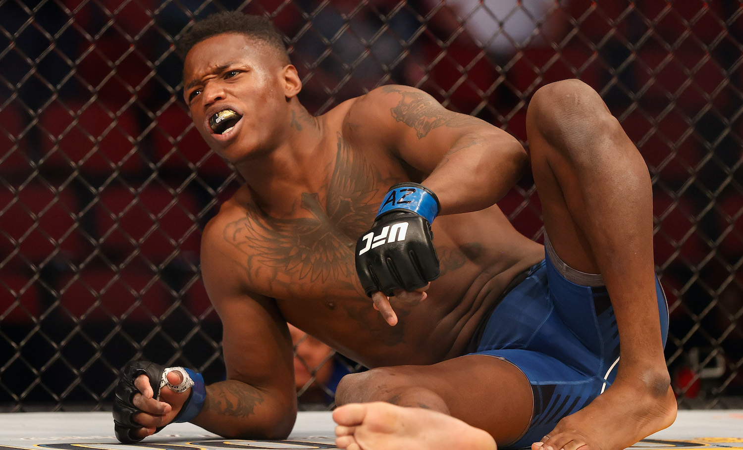 GLENDALE, ARIZONA - JUNE 12: Terrance McKinney hurts his knee celebrating his knock-out victory over Matt Frevola during their UFC 263 lightweight match at Gila River Arena on June 12, 2021 in Glendale, Arizona.