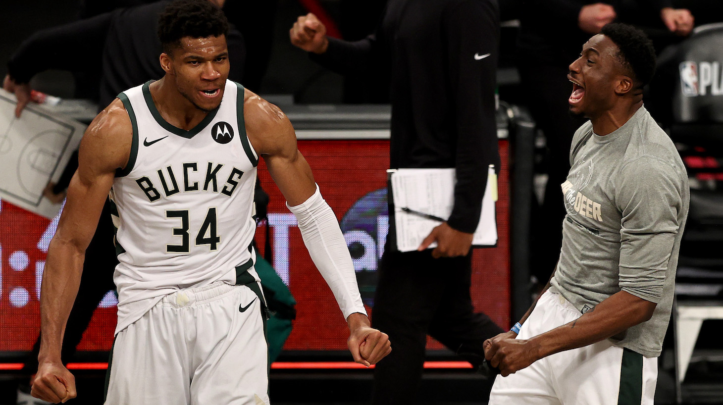 Giannis Antetokounmpo #34 and Thanasis Antetokounmpo #43 of the Milwaukee Bucks celebrate the win of game seven of the Eastern Conference second round at Barclays Center on June 19, 2021 in the Brooklyn borough of New York City. The Milwaukee Bucks defeated the Brooklyn Nets 115-111 in overtime to win the series.