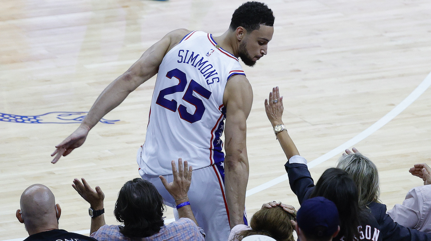 PHILADELPHIA, PENNSYLVANIA - JUNE 20: Ben Simmons #25 of the Philadelphia 76ers bumps into fans during the fourth quarter during Game Seven of the Eastern Conference Semifinals against the Atlanta Hawks at Wells Fargo Center on June 20, 2021 in Philadelphia, Pennsylvania. NOTE TO USER: User expressly acknowledges and agrees that, by downloading and or using this photograph, User is consenting to the terms and conditions of the Getty Images License Agreement. (Photo by Tim Nwachukwu/Getty Images)