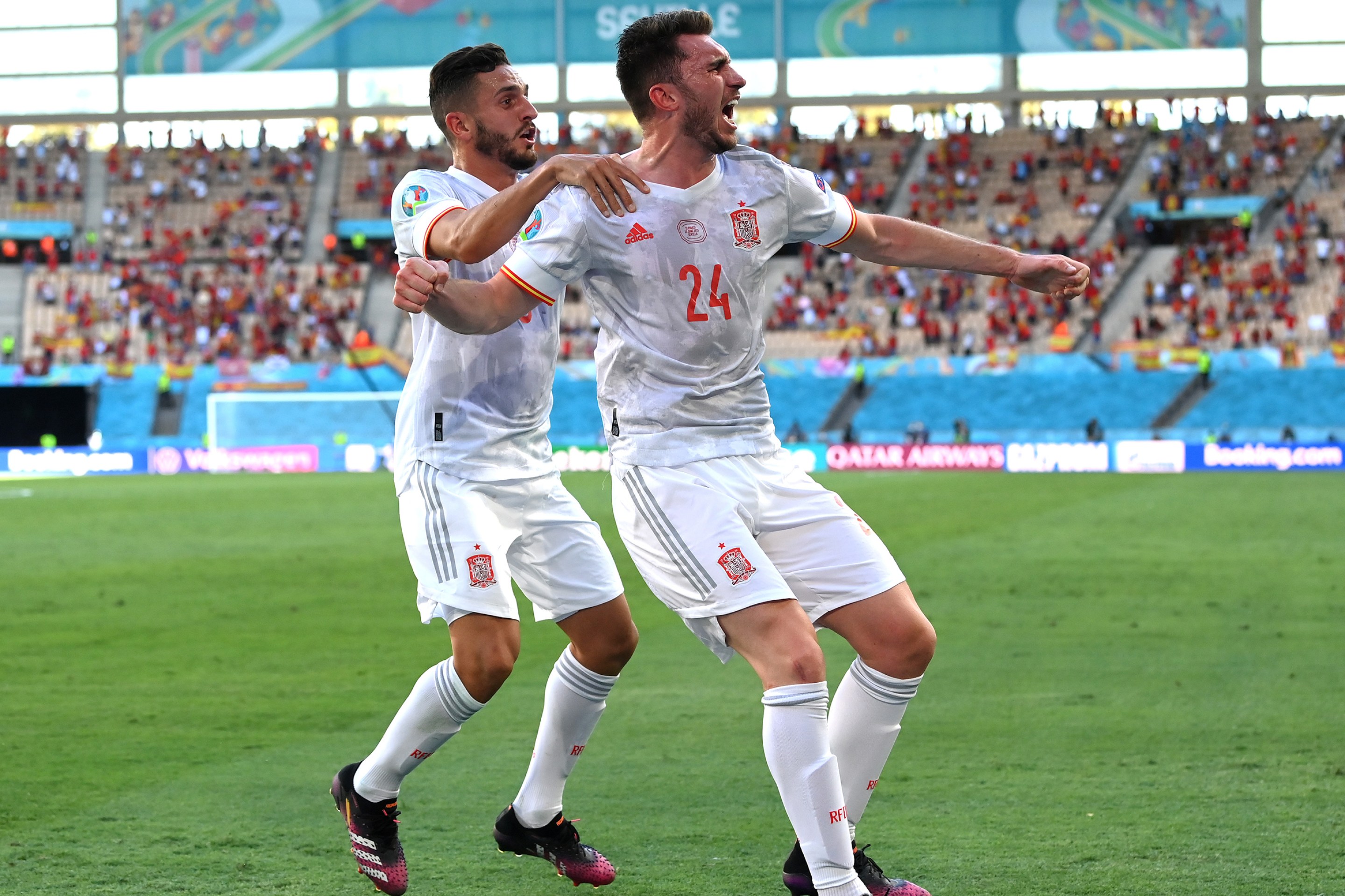 Aymeric Laporte of Spain celebrates with Koke after scoring their side's second goal during the UEFA Euro 2020 Championship Group E match between Slovakia and Spain at Estadio La Cartuja on June 23, 2021 in Seville, Spain.