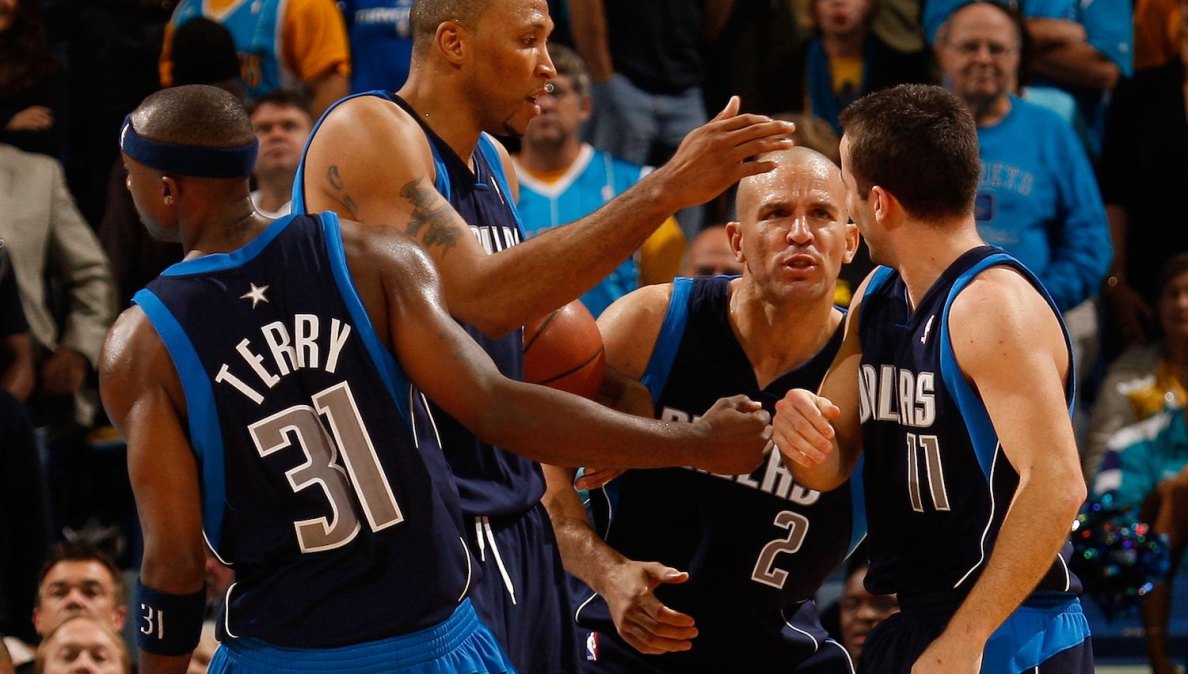 NEW ORLEANS - NOVEMBER 04: Jason Terry #31, Shawn Marion #0, Jason Kidd #2 congratulate Jose Barea #11 of the Dallas Mavericks during the game against the New Orleans Hornets at New Orleans Arena on November 4, 2009 in New Orleans, Louisiana. NOTE TO USER: User expressly acknowledges and agrees that, by downloading and or using this photograph, User is consenting to the terms and conditions of the Getty Images License Agreement. (Photo by Chris Graythen/Getty Images)