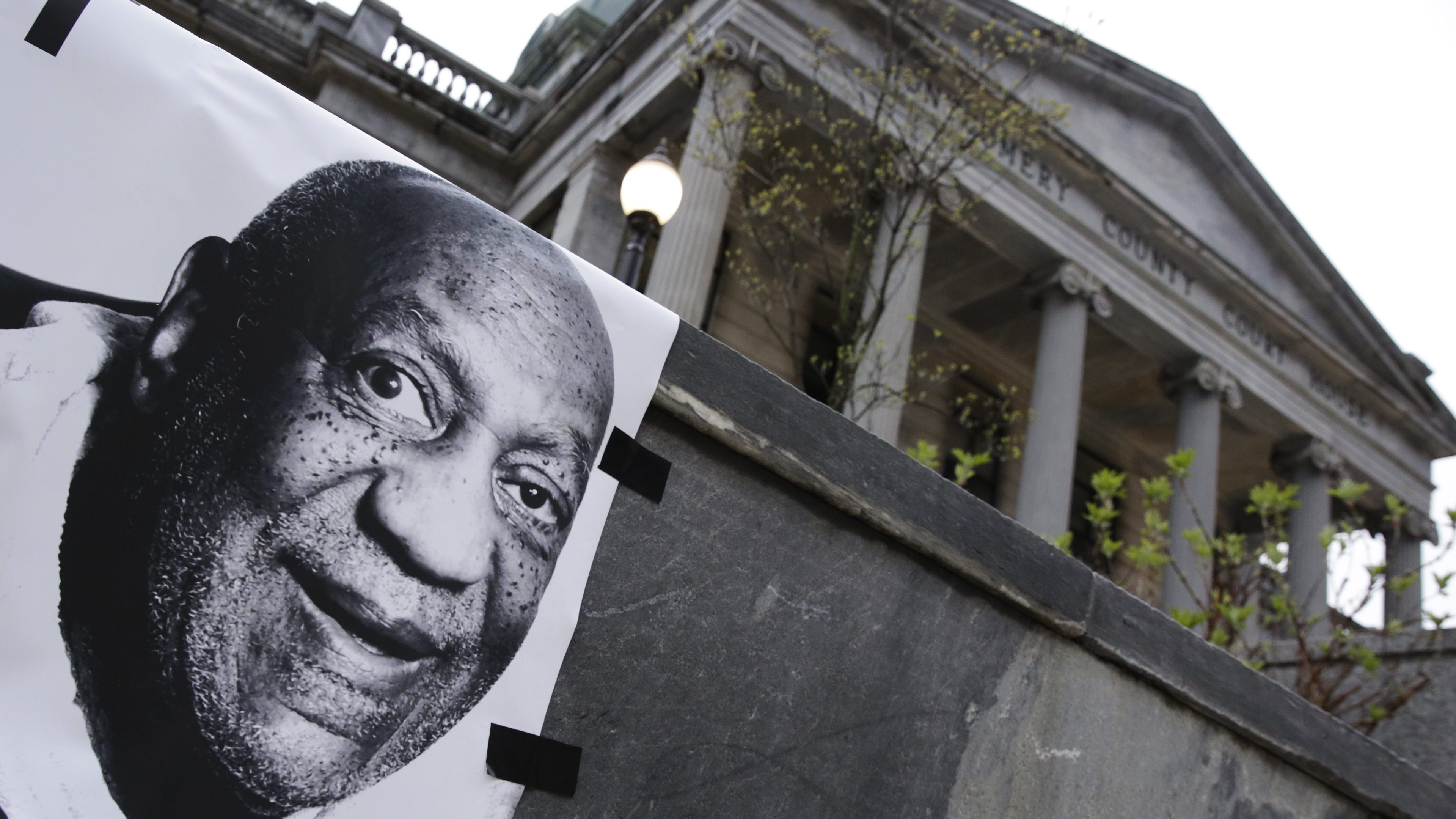A protest sign is seen in front of the Montgomery County Courthouse ahead of the start of jury deliberations in the retrial of actor and comedian Bill Cosby's sexual assault case in Norristown, Pennsylvania on April 25, 2018.