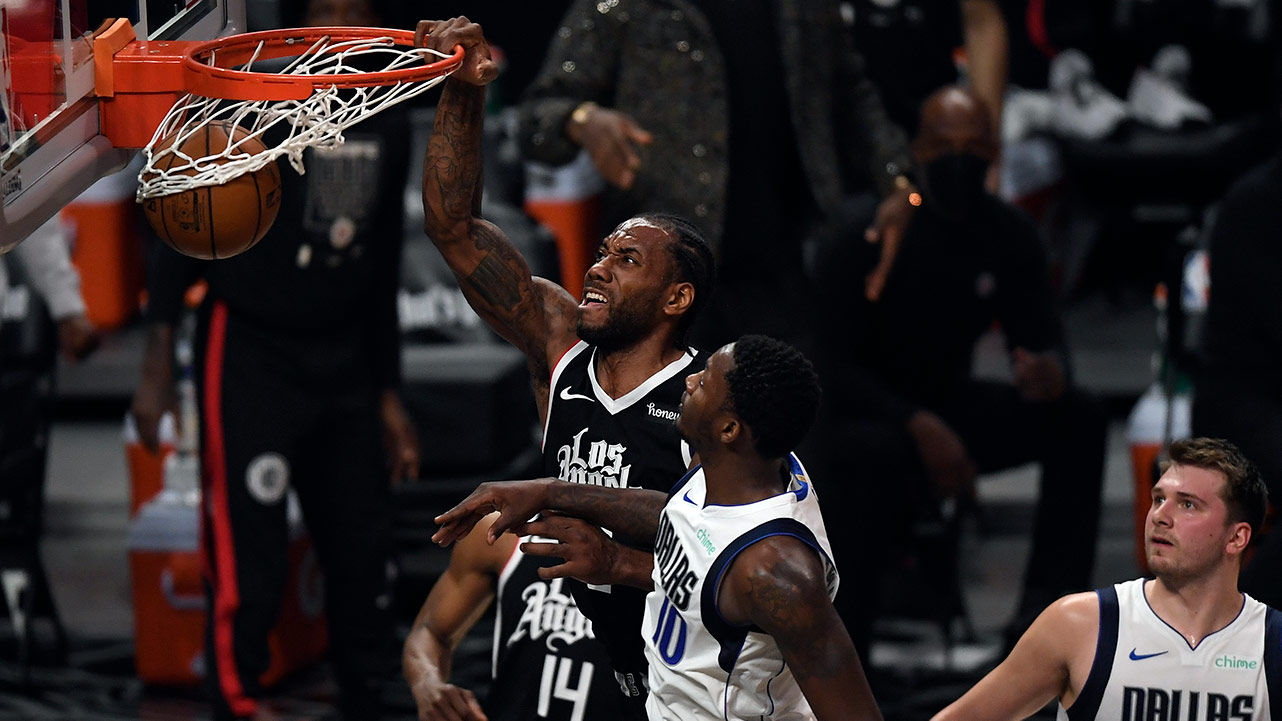 LOS ANGELES, CA - JUNE 06: Kawhi Leonard #2 of the Los Angeles Clippers dunks the ball against Dorian Finney-Smith #10 of the Dallas Mavericks during the first half of Game Seven of the Western Conference first round series at Staples Center on June 6, 2021 in Los Angeles, California.