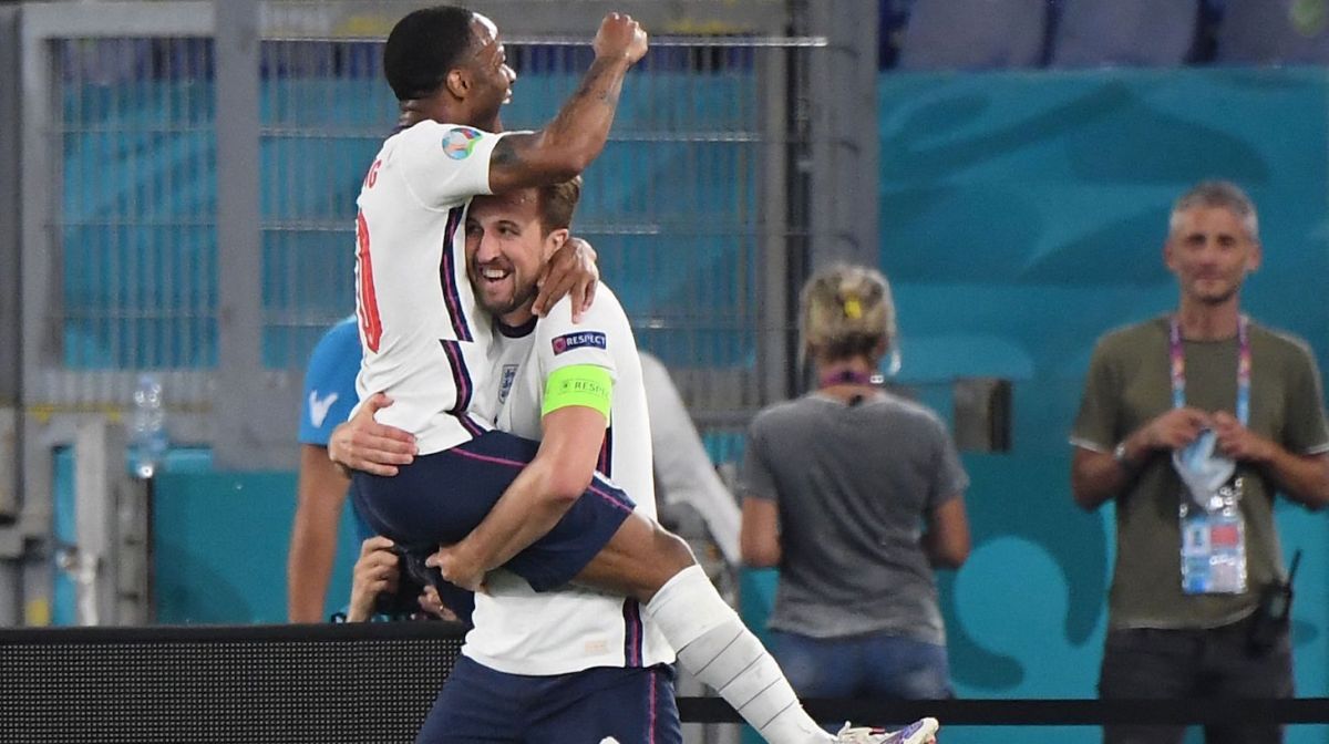 England's forward Harry Kane celebrates with England's forward Raheem Sterling (L) after scoring third goal during the UEFA EURO 2020 quarter-final football match between Ukraine and England at the Olympic Stadium in Rome on July 3, 2021.