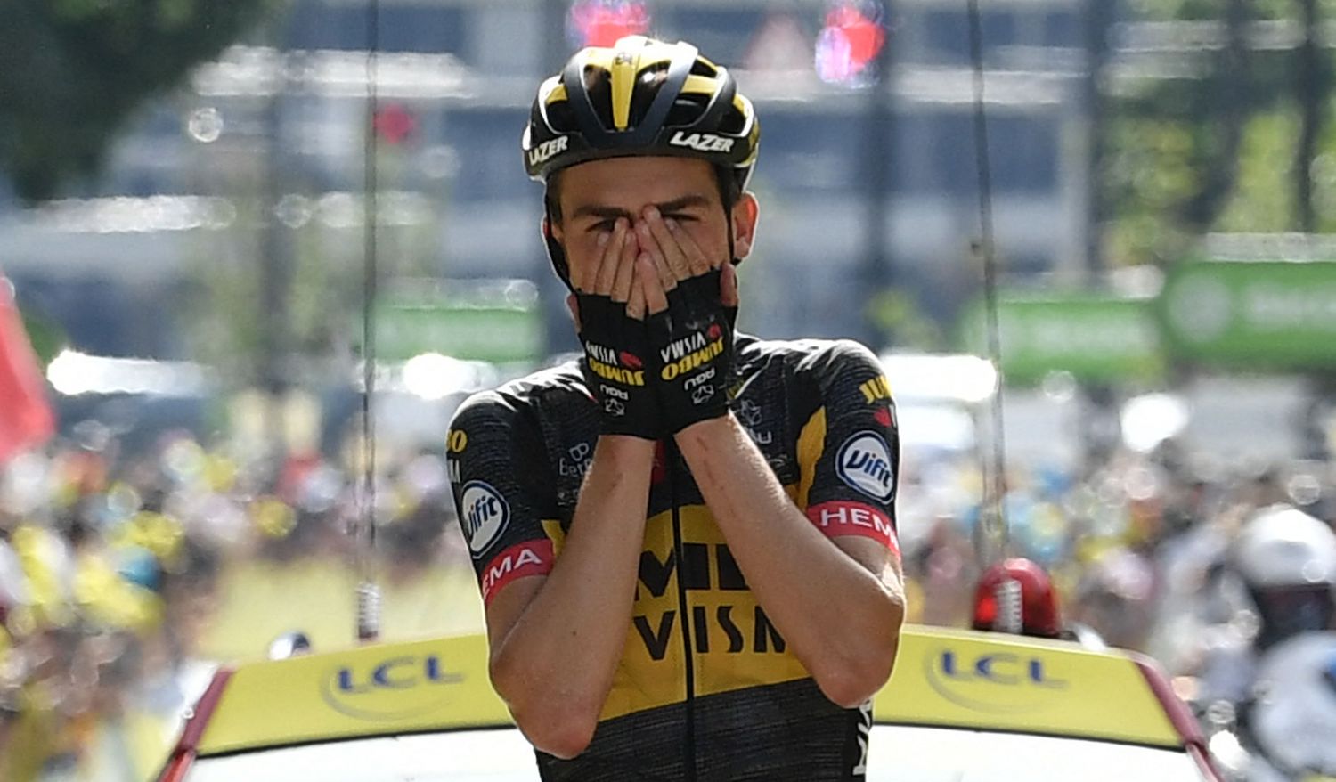 TOPSHOT - Team Jumbo Visma's Sepp Kuss of US celebrates as he crosses the finish line of the 15th stage of the 108th edition of the Tour de France cycling race, 191 km between Ceret and Andorre-La-Vieille, on July 11, 2021. (Photo by Philippe LOPEZ / AFP) (Photo by PHILIPPE LOPEZ/AFP via Getty Images)