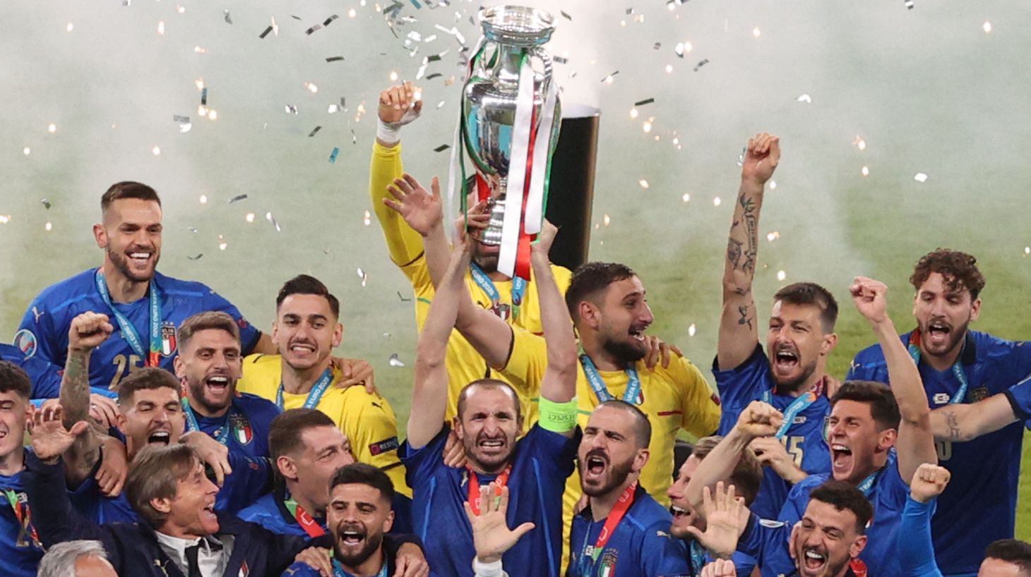 Italy's defender Giorgio Chiellini raises the European Championship trophy during the presentation after Italy won the UEFA EURO 2020 final football match between Italy and England at the Wembley Stadium in London on July 11, 2021.
