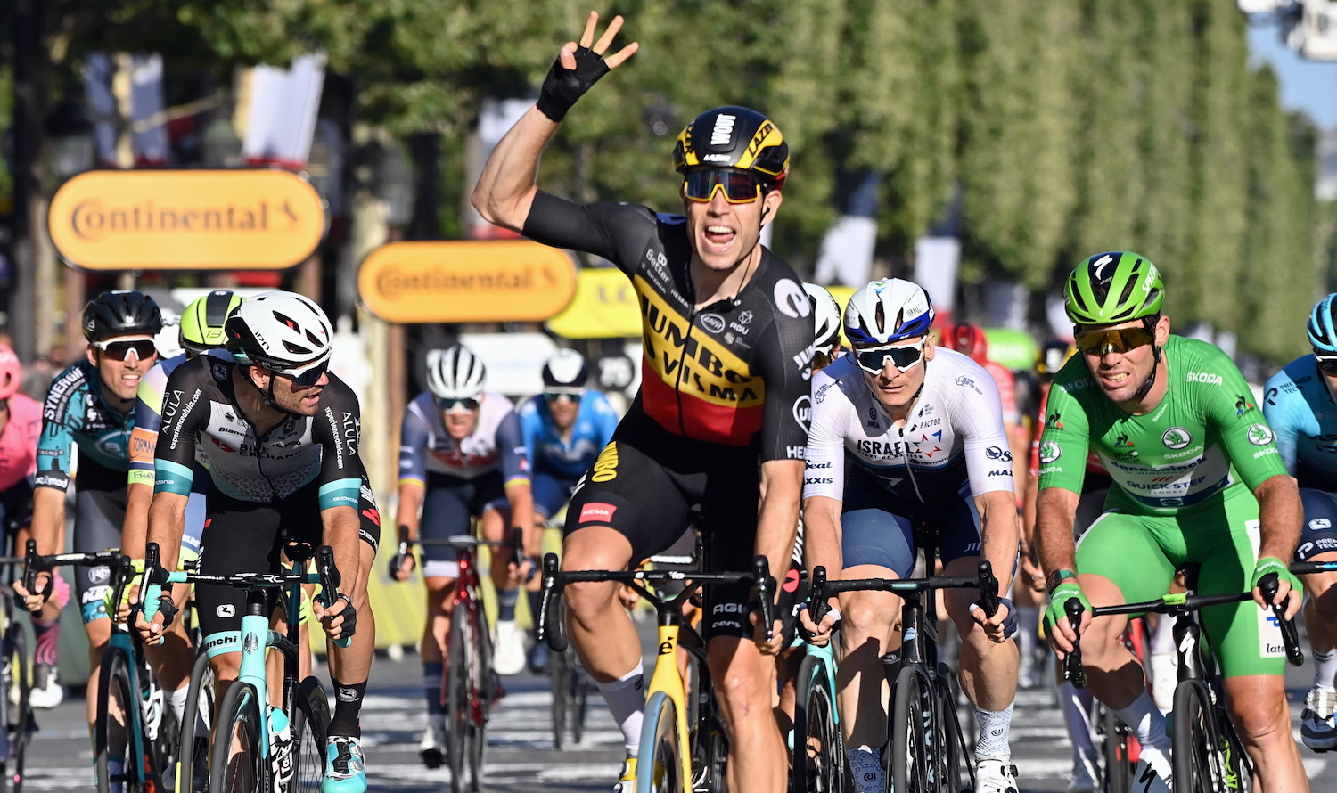 Belgian Wout Van Aert of Team Jumbo-Visma celebrates as he crosses the finish line to win the 21 and last stage of the 108th edition of the Tour de France cycling race, 108,4 km from Chatou to Paris in France, Sunday 18 July 2021. This year's Tour de France takes place from 26 June to 18 July 2021.