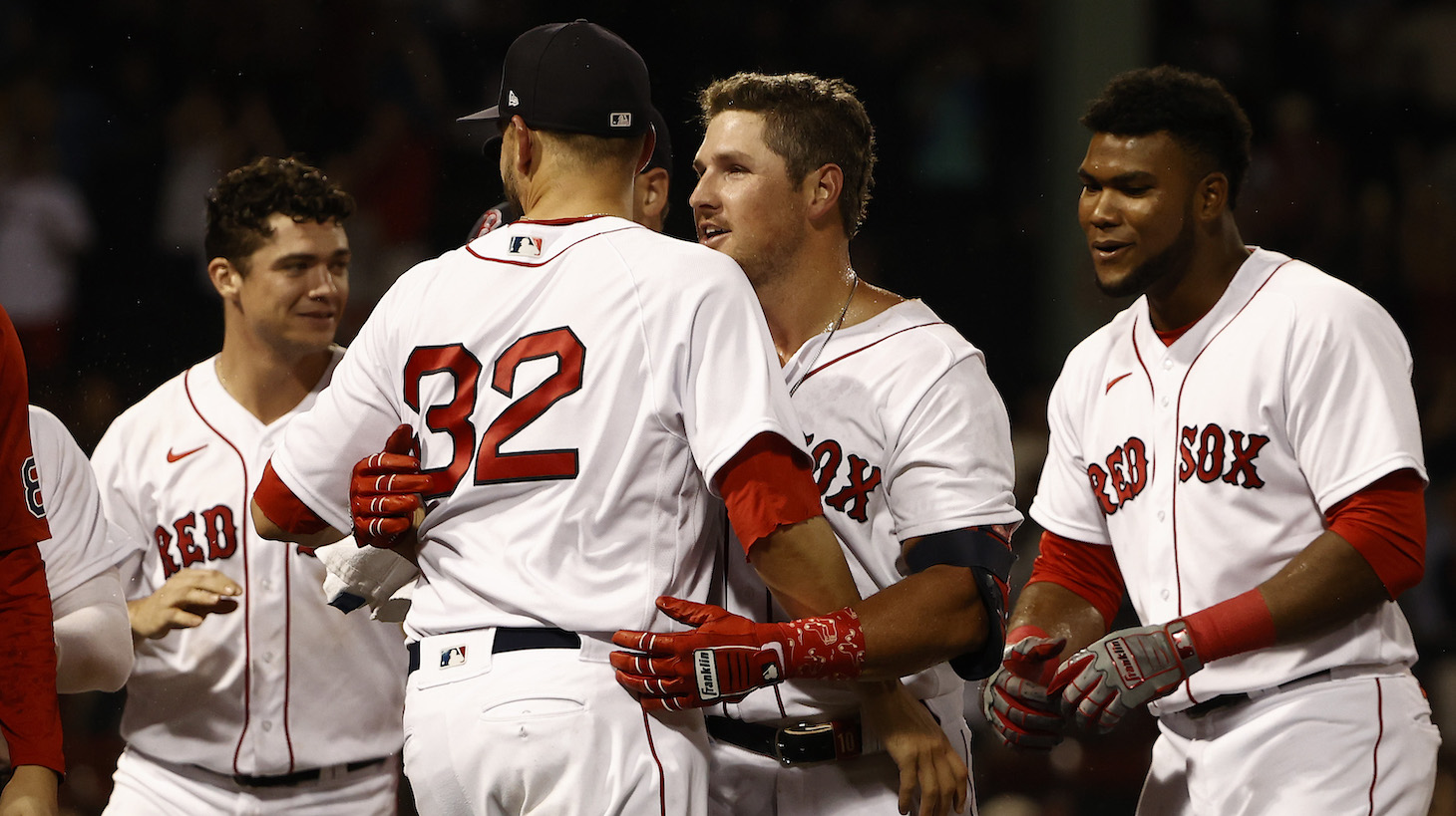 BOSTON, MA - JULY 22: Hunter Renfroe #10 of the Boston Red Sox is congratulated by Matt Barnes #32 after his game-winning sacrifice fly in the 10th inning against the New York Yankees at Fenway Park on July 22, 2021 in Boston, Massachusetts. (Photo By Winslow Townson/Getty Images)
