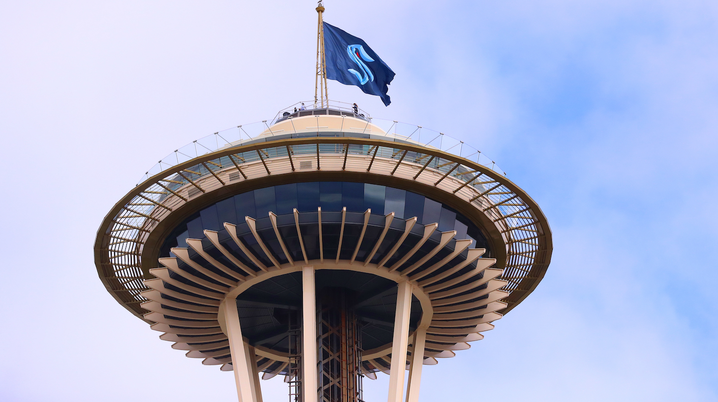 SEATTLE, WASHINGTON - JULY 23: A general view of the Space Needle as the Seattle Kraken team flag is hung from above on July 23, 2020 in Seattle, Washington. The NHL revealed the franchise's new team name today. (Photo by Abbie Parr/Getty Images)