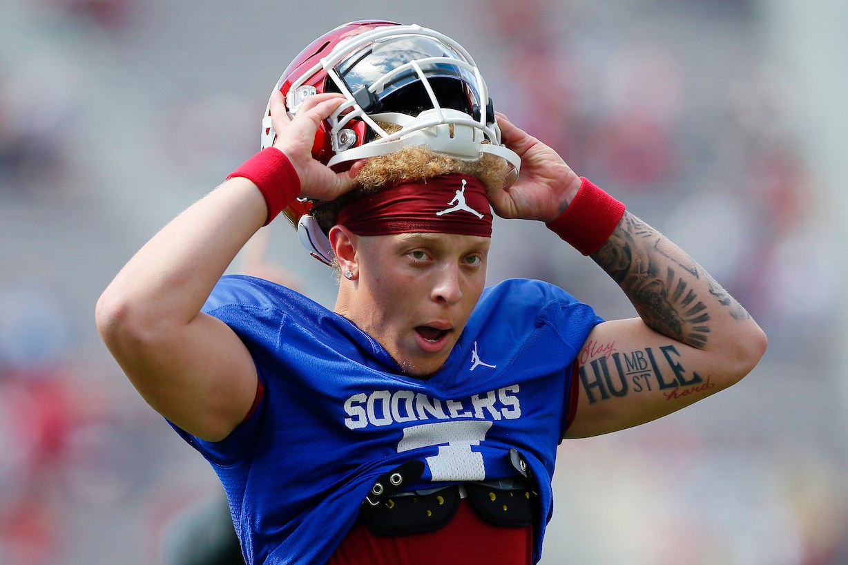 NORMAN, OK - APRIL 24: Quarterback Spencer Rattler #7 of the Oklahoma Sooners pulls on his helmet before the team's spring game at Gaylord Family Oklahoma Memorial Stadium on April 24, 2021 in Norman, Oklahoma. (Photo by Brian Bahr/Getty Images)