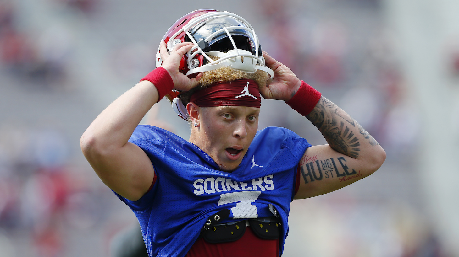 NORMAN, OK - APRIL 24: Quarterback Spencer Rattler #7 of the Oklahoma Sooners pulls on his helmet before the team's spring game at Gaylord Family Oklahoma Memorial Stadium on April 24, 2021 in Norman, Oklahoma. (Photo by Brian Bahr/Getty Images)