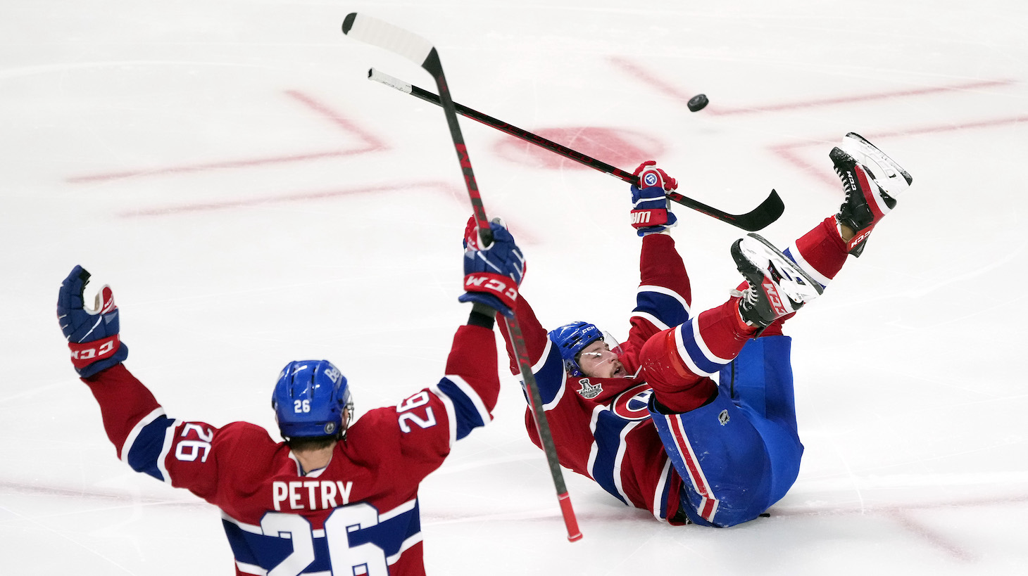 MONTREAL, QUEBEC - JULY 05: Josh Anderson #17 of the Montreal Canadiens celebrates with Jeff Petry #26 after scoring the game-winning goal to give his team the 3-2 win against the Tampa Bay Lightning during the first overtime period in Game Four of the 2021 NHL Stanley Cup Final at the Bell Centre on July 05, 2021 in Montreal, Quebec, Canada. (Photo by Mark Blinch/Getty Images)