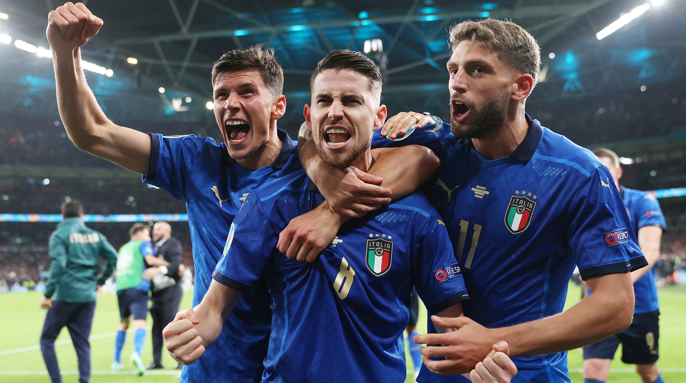 Jorginho of Italy celebrates with Matteo Pessina and Domenico Berardi after scoring their sides winning penalty in the penalty shoot out during the UEFA Euro 2020 Championship Semi-final match between Italy and Spain at Wembley Stadium on July 06, 2021 in London, England.