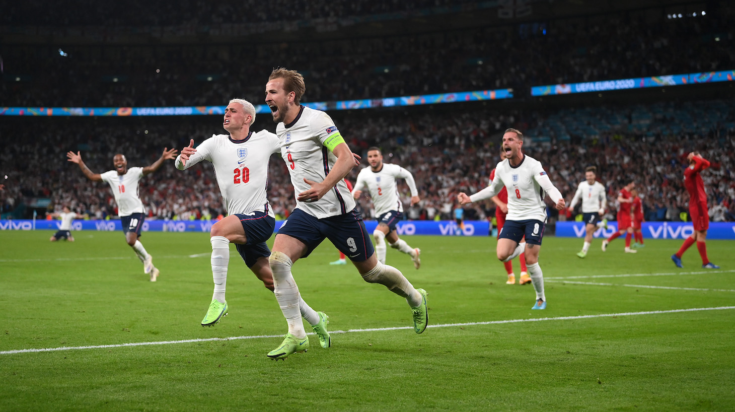 Harry Kane of England is congratulated by Phil Foden after scoring the second goal during the UEFA Euro 2020 Championship Semi-final match between England and Denmark at Wembley Stadium on July 07, 2021 in London, England.