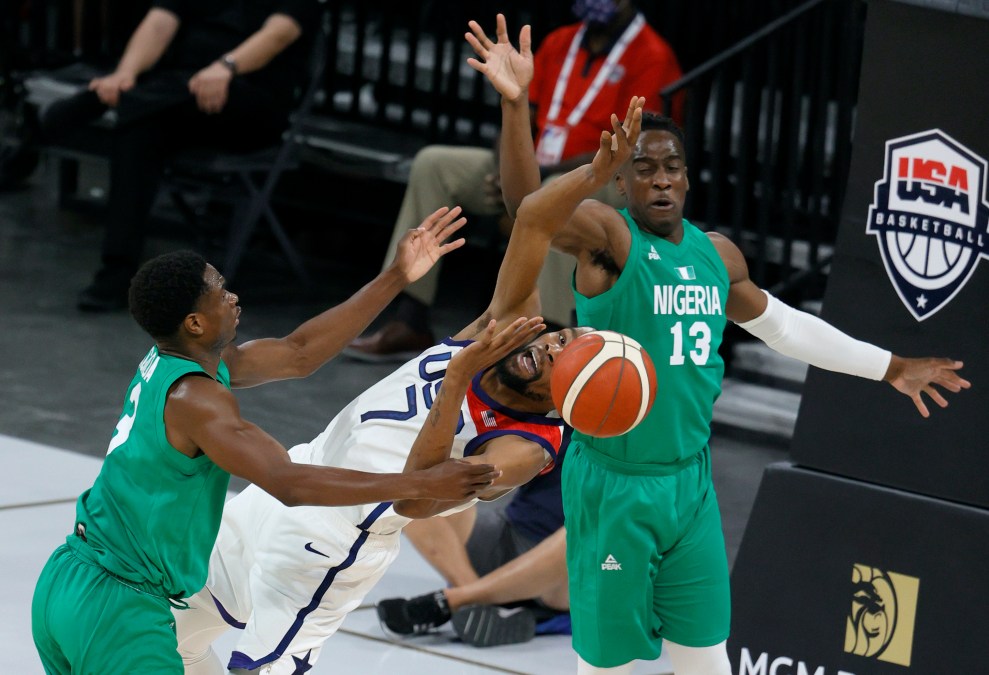 Caleb Agada #3 of Nigeria fouls Kevin Durant #7 of the United States as Miye Oni #13 of Nigeria defends during an exhibition game at Michelob ULTRA Arena ahead of the Tokyo Olympic Games on July 10, 2021 in Las Vegas, Nevada.