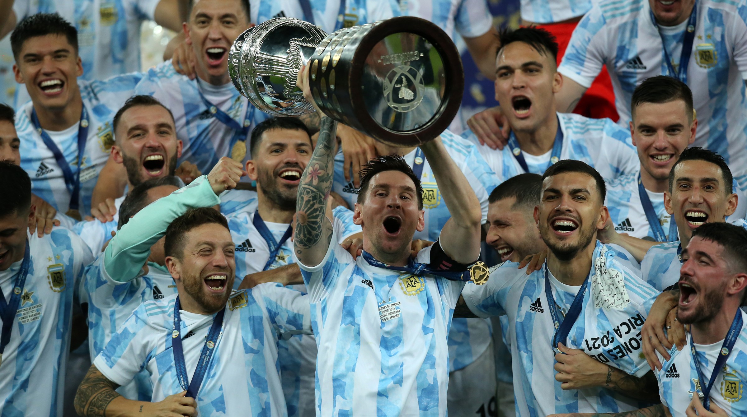 Lionel Messi of Argentina lifts the trophy with teammates after winning the final of Copa America Brazil 2021 between Brazil and Argentina at Maracana Stadium on July 10, 2021 in Rio de Janeiro, Brazil.