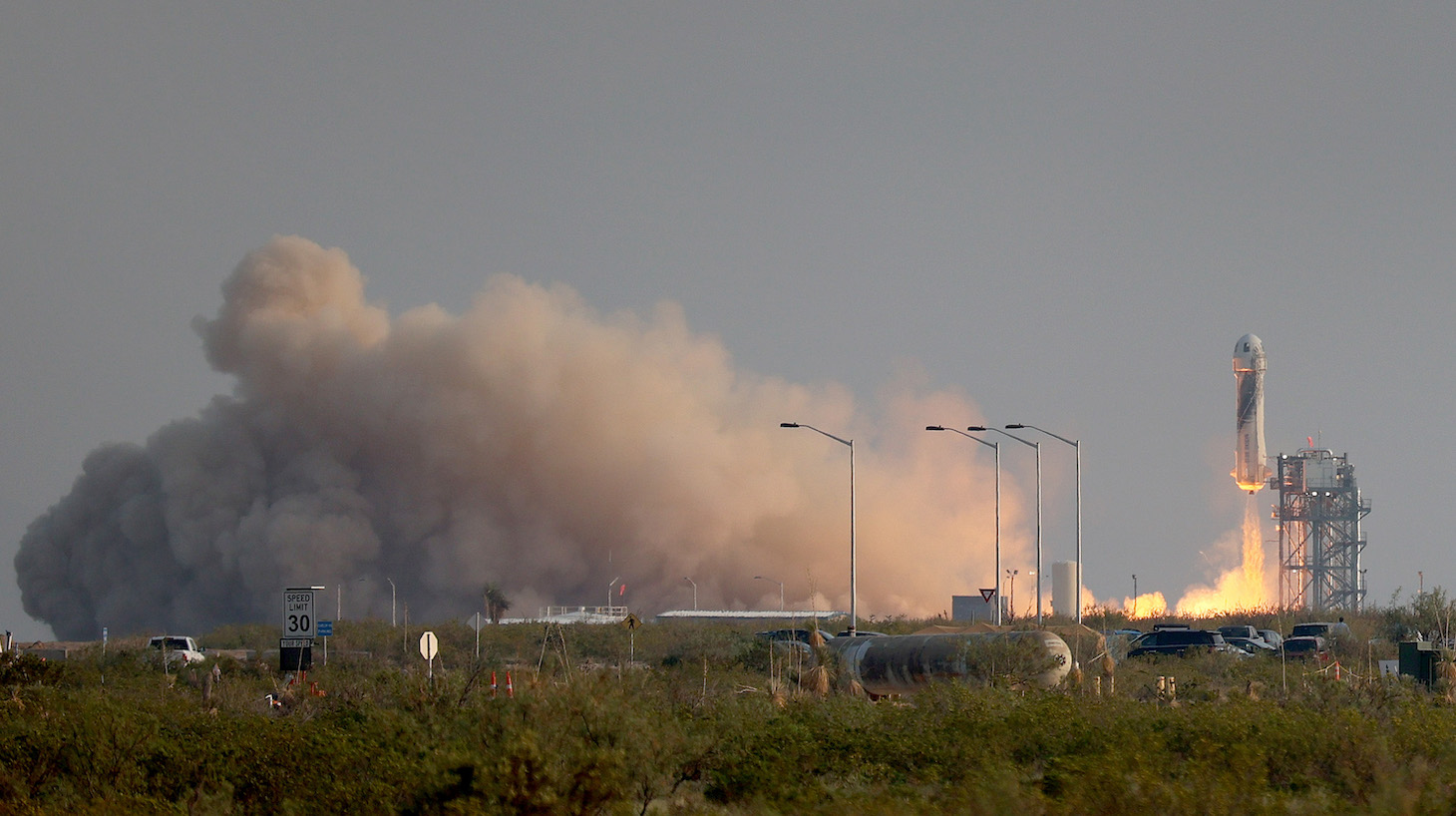 VAN HORN, TEXAS - JULY 20: The New Shepard Blue Origin rocket lifts-off from the launch pad carrying Jeff Bezos along with his brother Mark Bezos, 18-year-old Oliver Daemen, and 82-year-old Wally Funk prepare to launch on July 20, 2021 in Van Horn, Texas. Mr. Bezos and the crew are riding in the first human spaceflight for the company. (Photo by Joe Raedle/Getty Images)