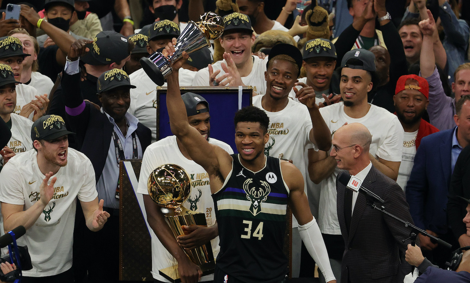 MILWAUKEE, WISCONSIN - JULY 20: Giannis Antetokounmpo #34 of the Milwaukee Bucks celebrates winning the Bill Russell NBA Finals MVP Award after defeating the Phoenix Suns in Game Six to win the 2021 NBA Finals at Fiserv Forum on July 20, 2021 in Milwaukee, Wisconsin. NOTE TO USER: User expressly acknowledges and agrees that, by downloading and or using this photograph, User is consenting to the terms and conditions of the Getty Images License Agreement. (Photo by Jonathan Daniel/Getty Images)