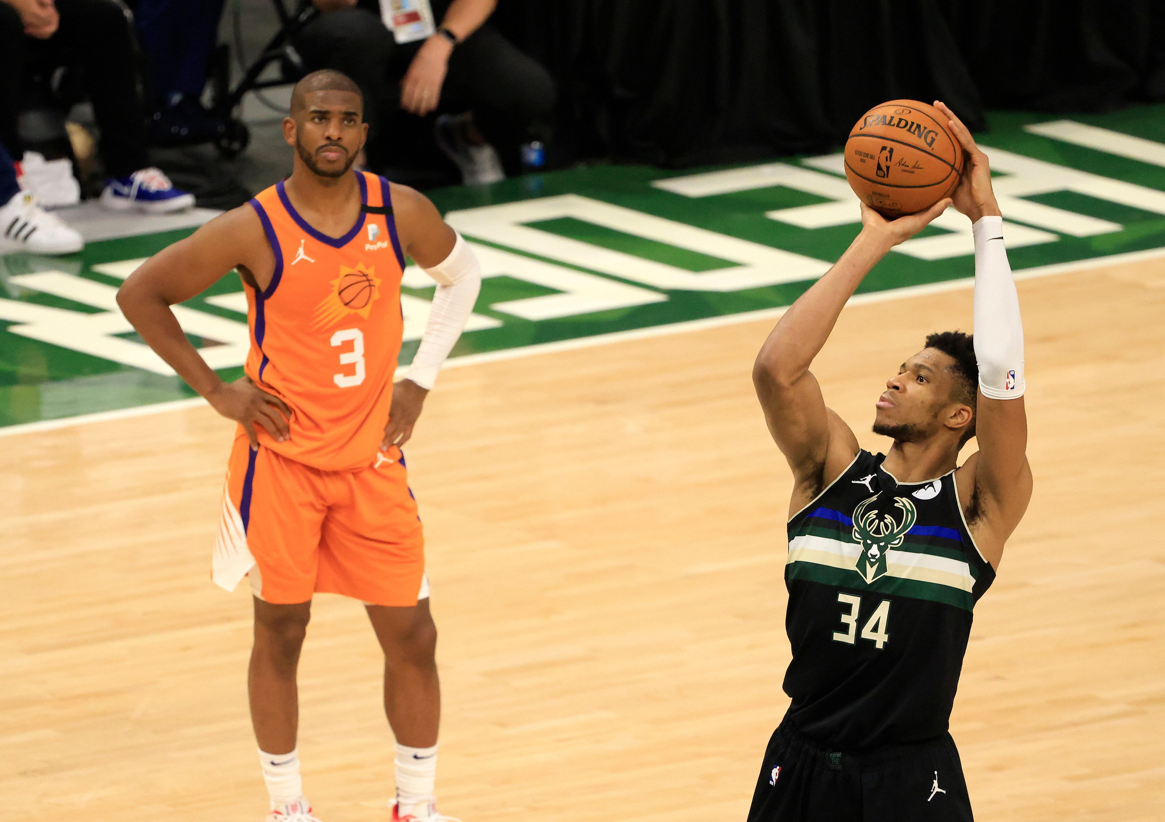 MILWAUKEE, WISCONSIN - JULY 20: Giannis Antetokounmpo #34 of the Milwaukee Bucks shoots a free throw as Chris Paul #3 of the Phoenix Suns watches during the second half in Game Six of the NBA Finals at Fiserv Forum on July 20, 2021 in Milwaukee, Wisconsin. NOTE TO USER: User expressly acknowledges and agrees that, by downloading and or using this photograph, User is consenting to the terms and conditions of the Getty Images License Agreement.