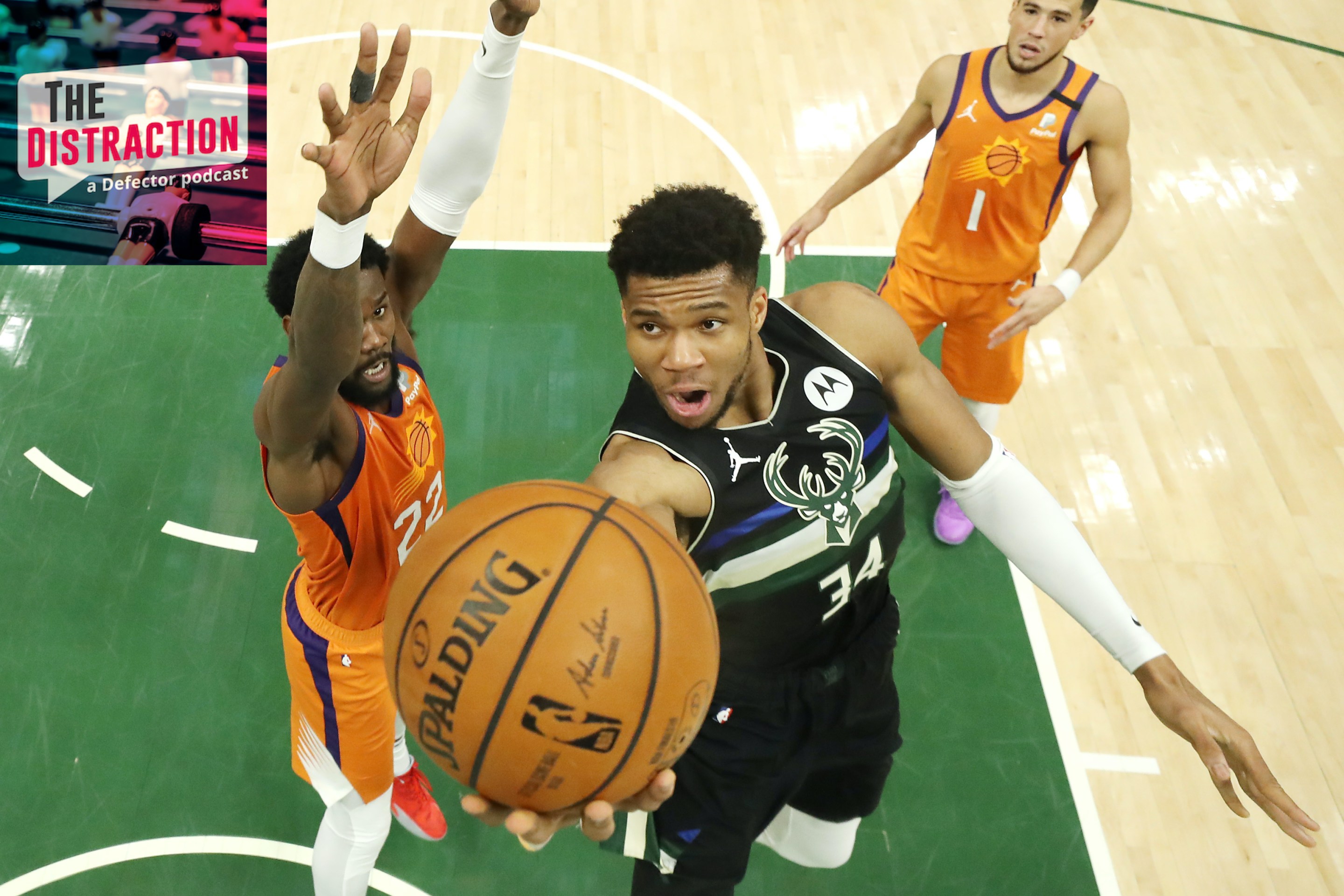 Giannis Antetokounmpo driving for one of his many baskets in the decisive Game 6 of the NBA Finals.