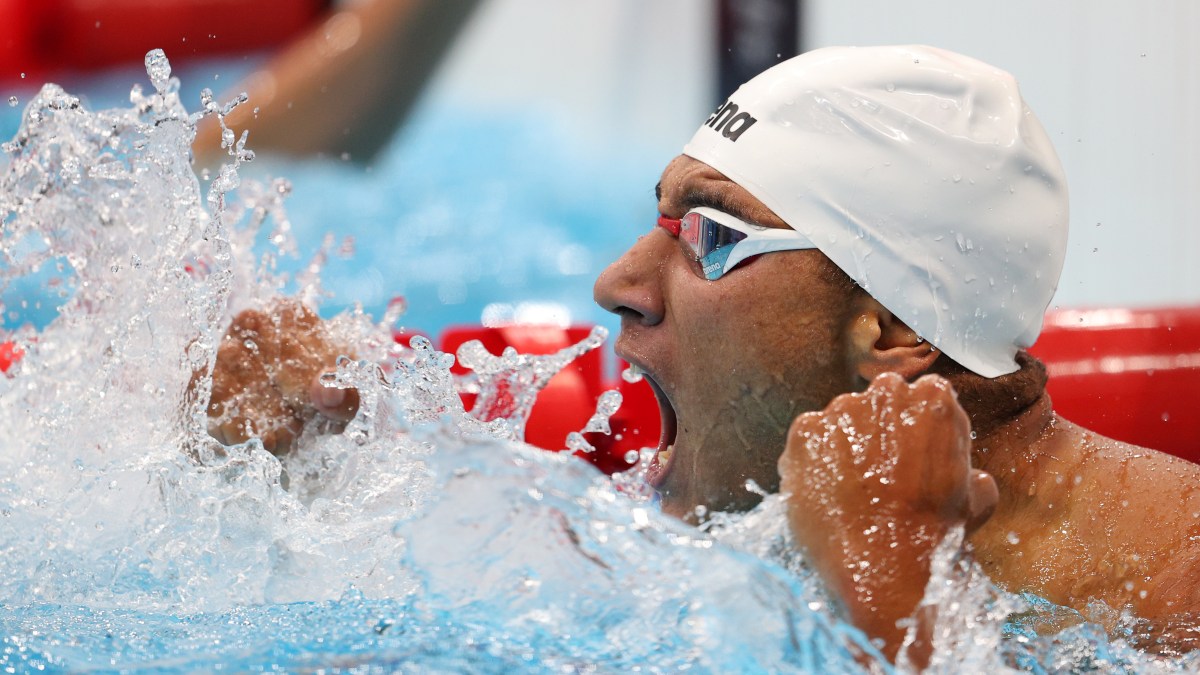 Ahmed Hafnaoui of Team Tunisia celebrates after winning the gold medal in the Men's 400m Freestyle Final on day two of the Tokyo 2020 Olympic Games at Tokyo Aquatics Centre on July 25, 2021 in Tokyo, Japan.