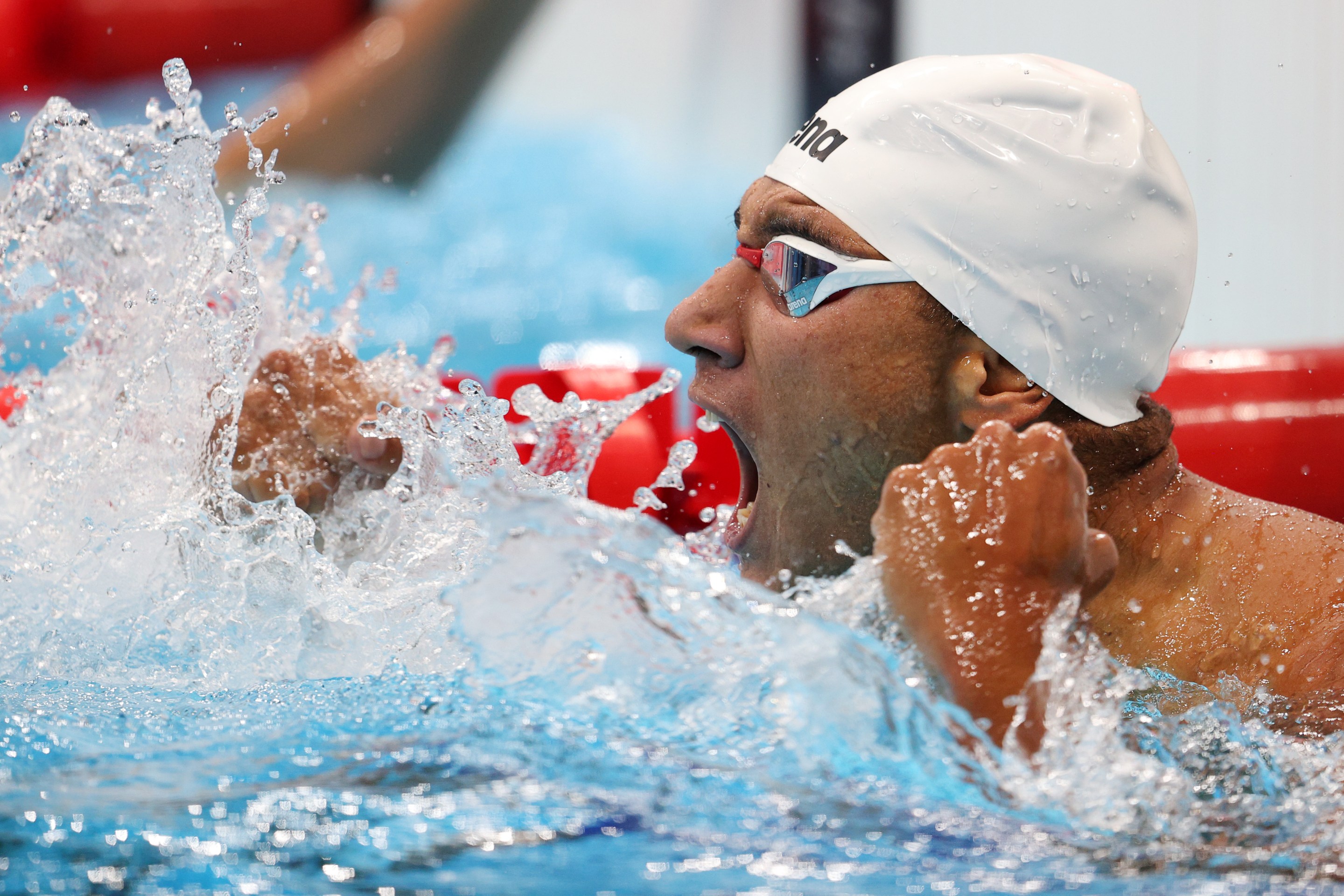 Ahmed Hafnaoui of Team Tunisia celebrates after winning the gold medal in the Men's 400m Freestyle Final on day two of the Tokyo 2020 Olympic Games at Tokyo Aquatics Centre on July 25, 2021 in Tokyo, Japan.