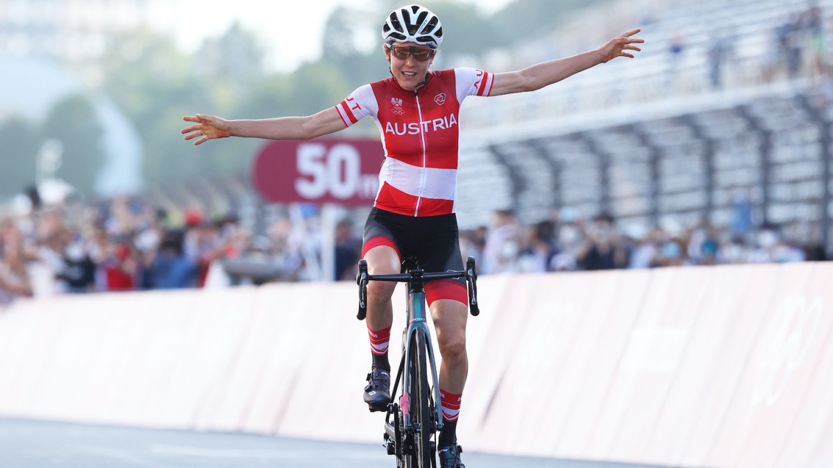 OYAMA, JAPAN - JULY 25: Anna Kiesenhofer of Team Austria celebrates winning the gold medal during the Women's road race on day two of the Tokyo 2020 Olympic Games at Fuji International Speedway on July 25, 2021 in Oyama, Shizuoka, Japan. (Photo by Michael Steele/Getty Images)