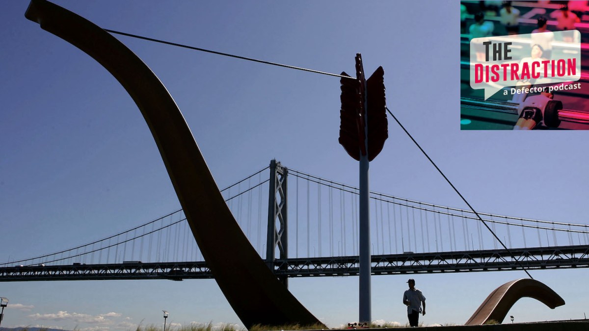 SAN FRANCISCO - MARCH 25: A man walks past a sculpture of a bow and arrow near the San Francisco Bay Bridge March 25, 2005 in San Francisco, California. San Francisco's 49-Mile Scenic Drive was opened in 1939 as a guide for visitors to The City's 1939-1940 Golden Gate International Exposition. The route includes most of San Francisco's major sights as well as winding through many of the city's colorful neighborhoods; giving visitors a look into the diversity and beauty of the area. (Photo by Justin Sullivan/Getty Images)