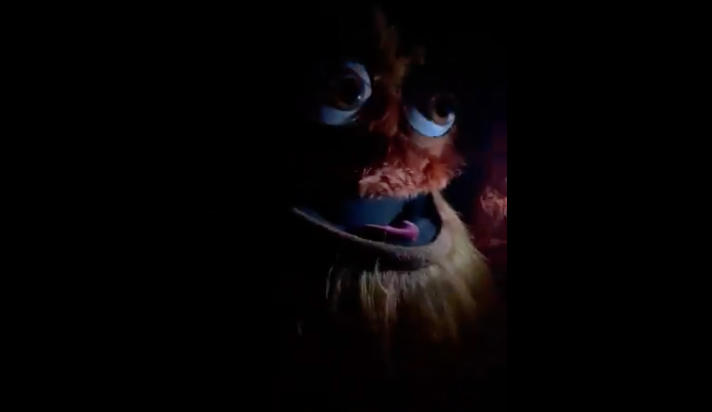 An image of Gritty in the dark looking vaguely strange and scary, if you did not know it was Gritty.