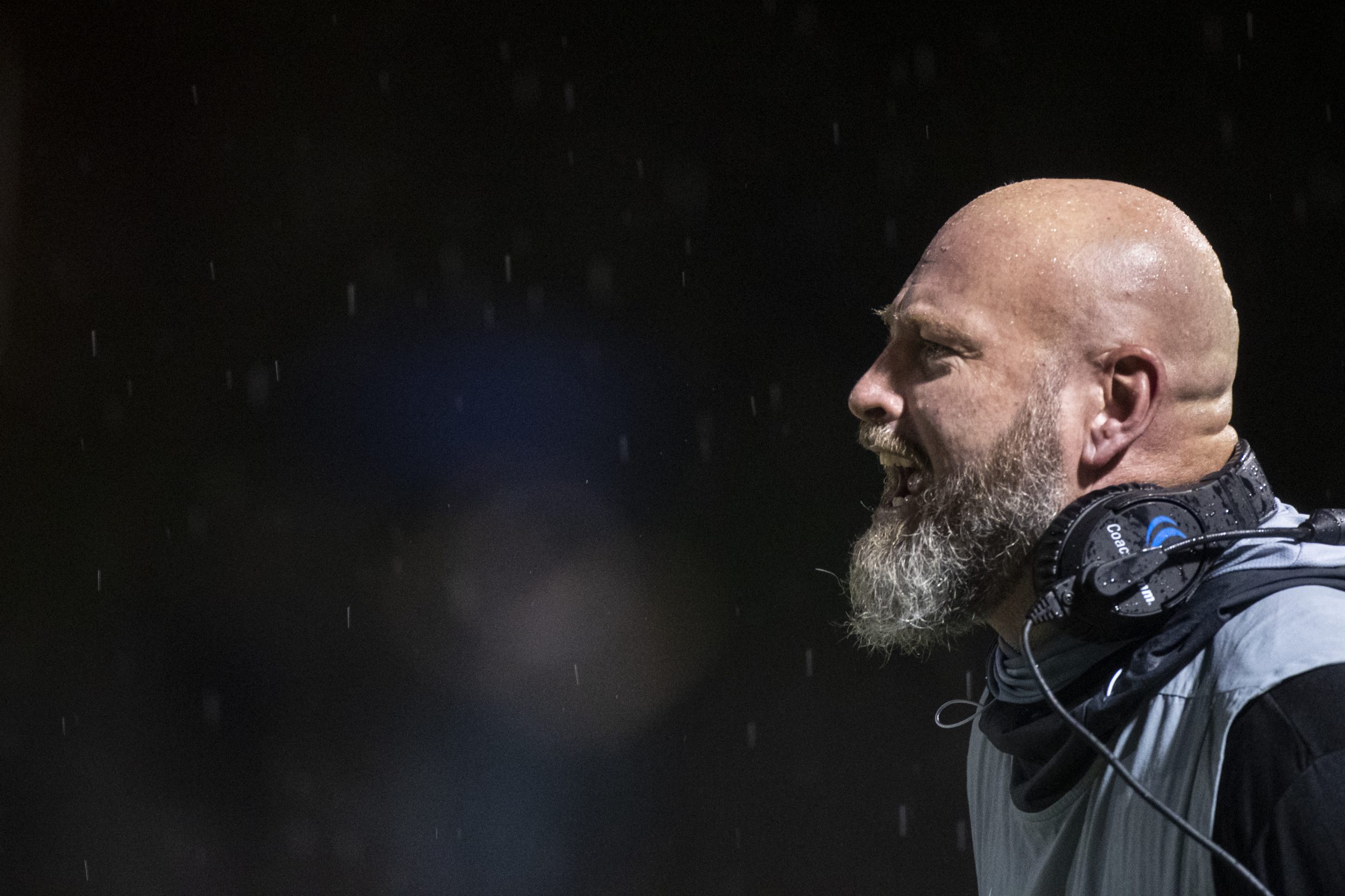 Trent Dilfer screams from the sideline of a high school football game.