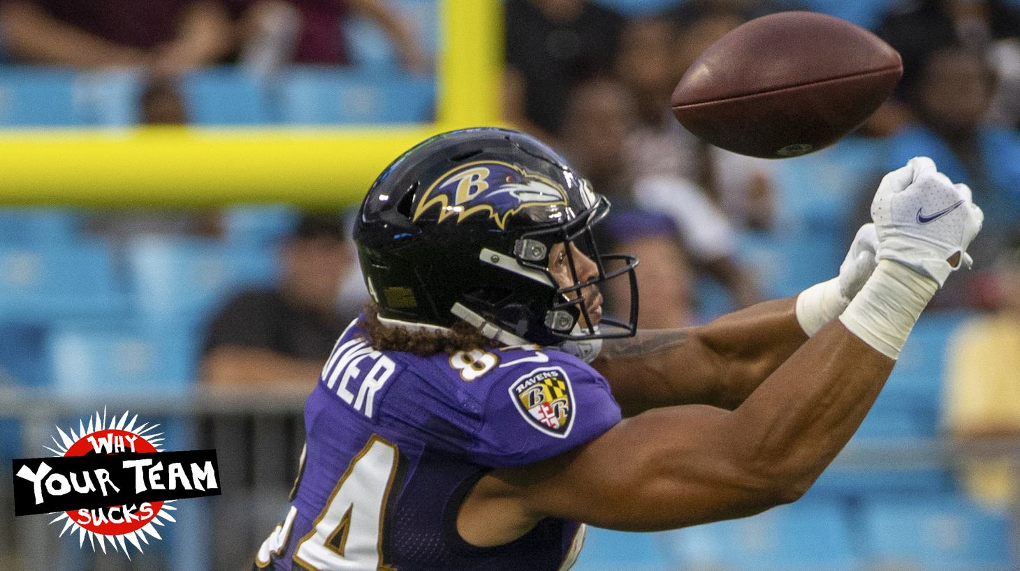 CHARLOTTE, NC - AUGUST 21: Josh Oliver #84 of the Baltimore Ravens attempts to make a catch against the Carolina Panthers during the first half of a NFL preseason game at Bank of America Stadium on August 21, 2021 in Charlotte, North Carolina. (Photo by Chris Keane/Getty Images)