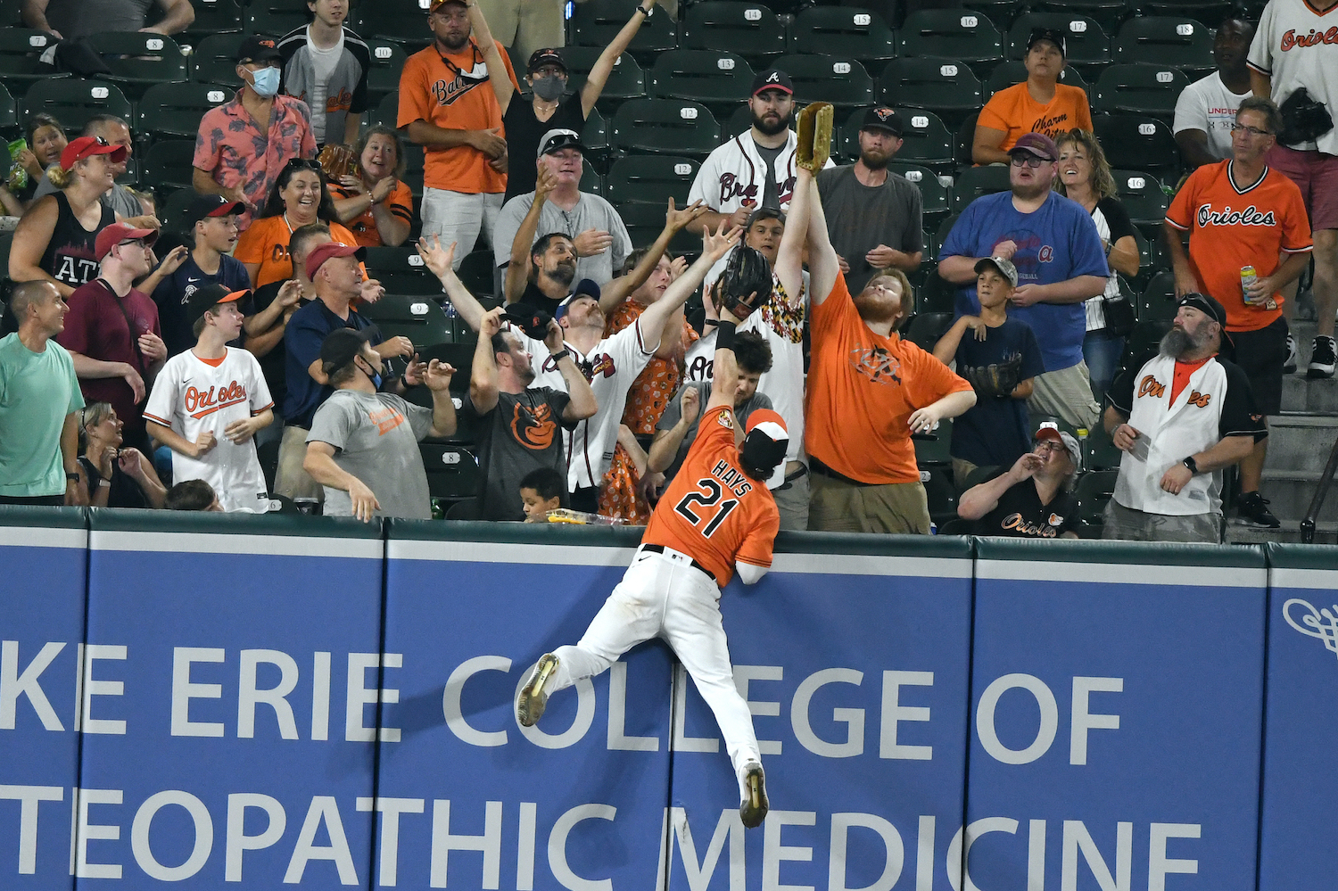 Austin Hays #21 of the Baltimore Orioles can not get to a home run hit ball by Austin Riley #27 (not pictured) of the Atlanta Braves fifth inning during a baseball game at Oriole Park at Camden Yards on August 21, 2021 in Baltimore, Maryland.