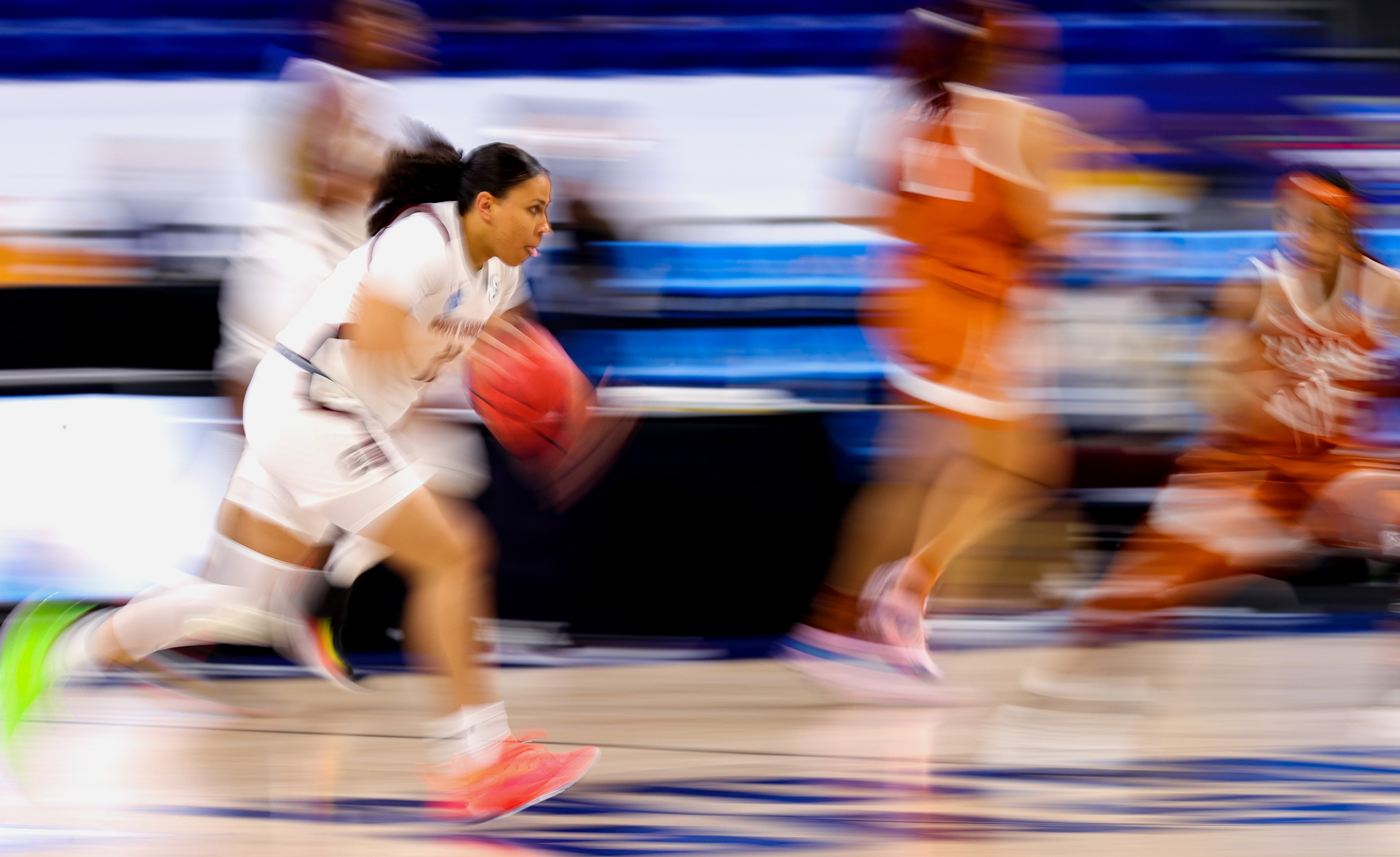 Destiny Littleton #11 of the South Carolina Gamecocks controls the ball during the second half against the Texas Longhorns in the Elite Eight round of the NCAA Women's Basketball Tournament at the Alamodome on March 30, 2021 in San Antonio, Texas.
