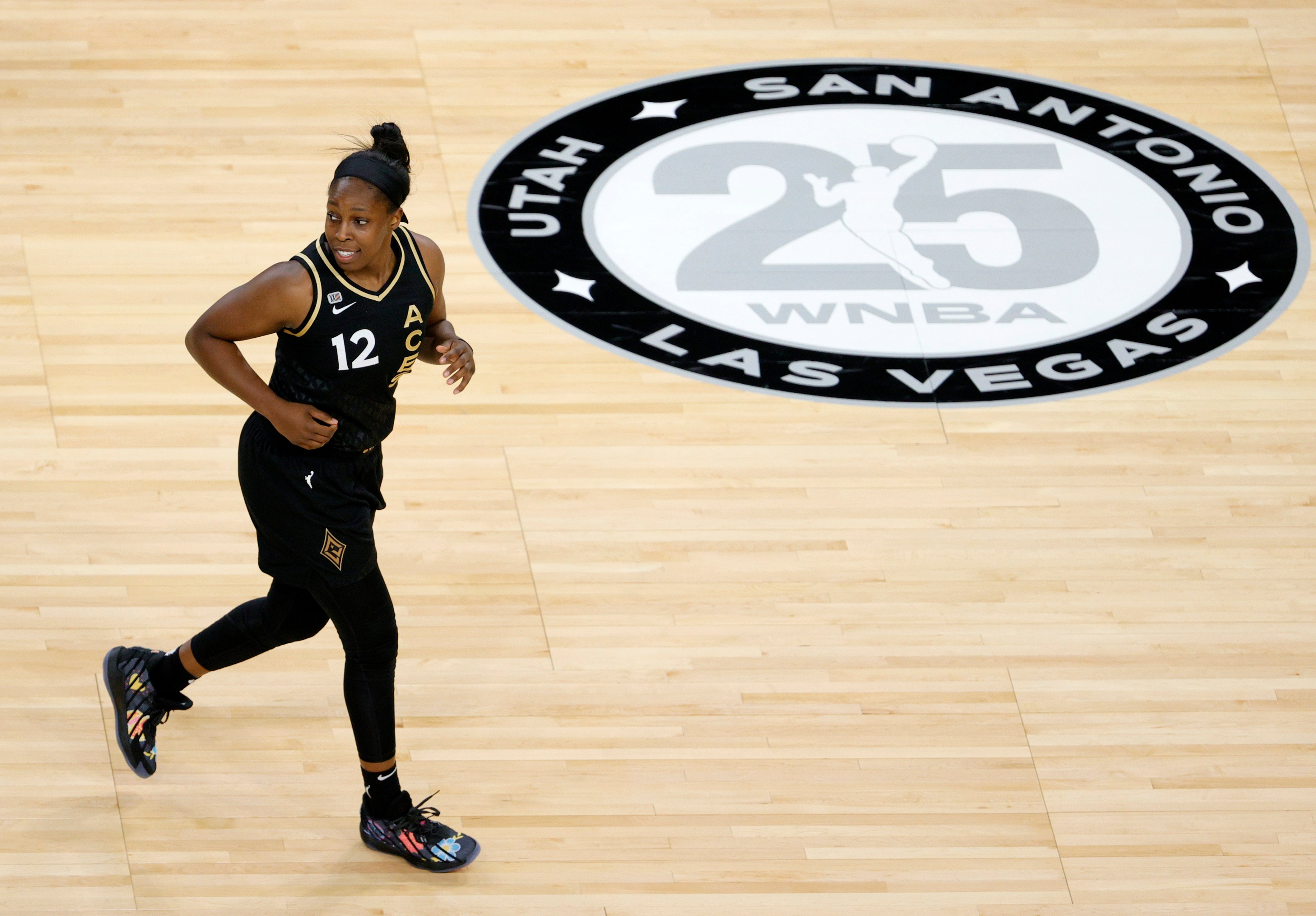 Chelsea Gray #12 of the Las Vegas Aces runs back on defense after scoring against the Los Angeles Sparks during their game at Michelob ULTRA Arena on May 21, 2021 in Las Vegas, Nevada. The Aces defeated the Sparks 97-69.