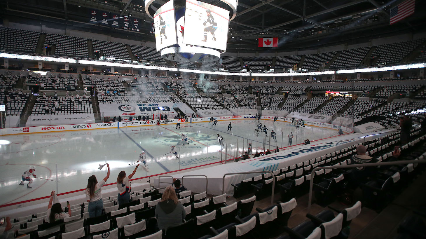 WINNIPEG, MANITOBA - JUNE 04: A limited number of fans cheer as the Winnipeg Jets face off against the Montreal Canadiens to start Game Two of the Second Round of the 2021 Stanley Cup Playoffs on June 4, 2021 at Bell MTS Place in Winnipeg, Manitoba, Canada. (Photo by Jason Halstead/Getty Images)