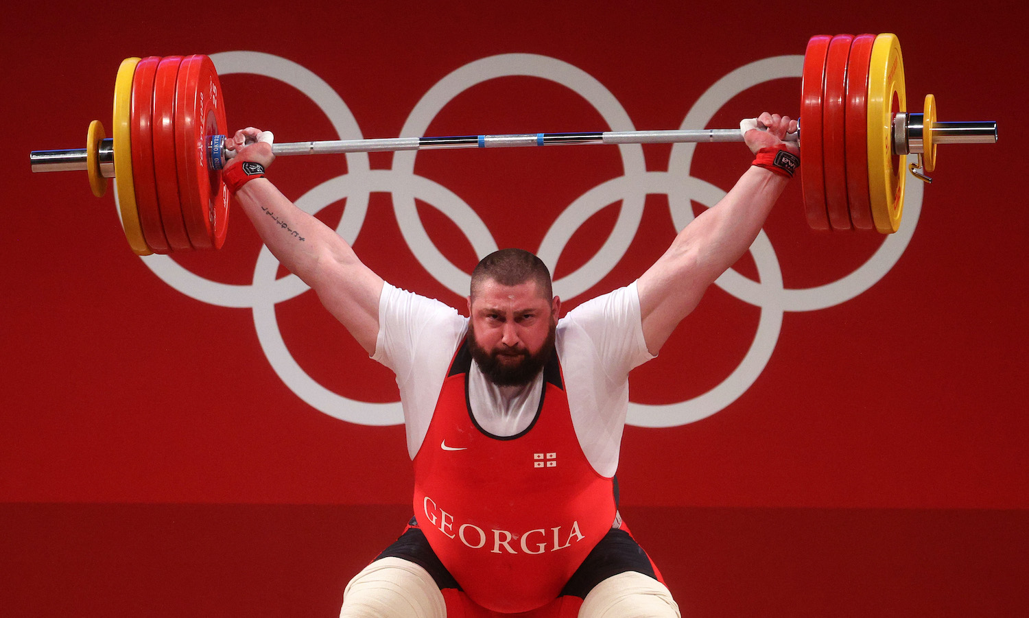 TOKYO, JAPAN - AUGUST 04: Lasha Talakhadze of Team Georgia competes during the Weightlifting - Men's 109kg+ Group A on day twelve of the Tokyo 2020 Olympic Games at Tokyo International Forum on August 04, 2021 in Tokyo, Japan. (Photo by Chris Graythen/Getty Images)