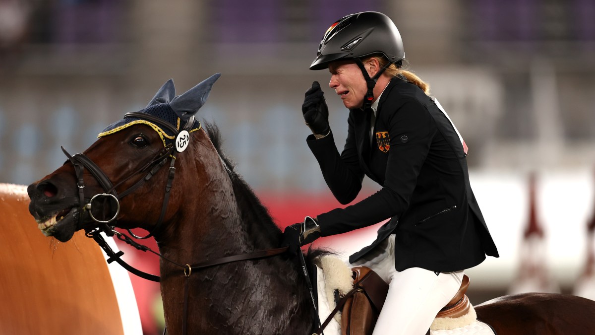 CHOFU, JAPAN - AUGUST 06: Annika Schleu of Team Germany looks dejected following her run in the Riding Show Jumping of the Women's Modern Pentathlon on day fourteen of the Tokyo 2020 Olympic Games