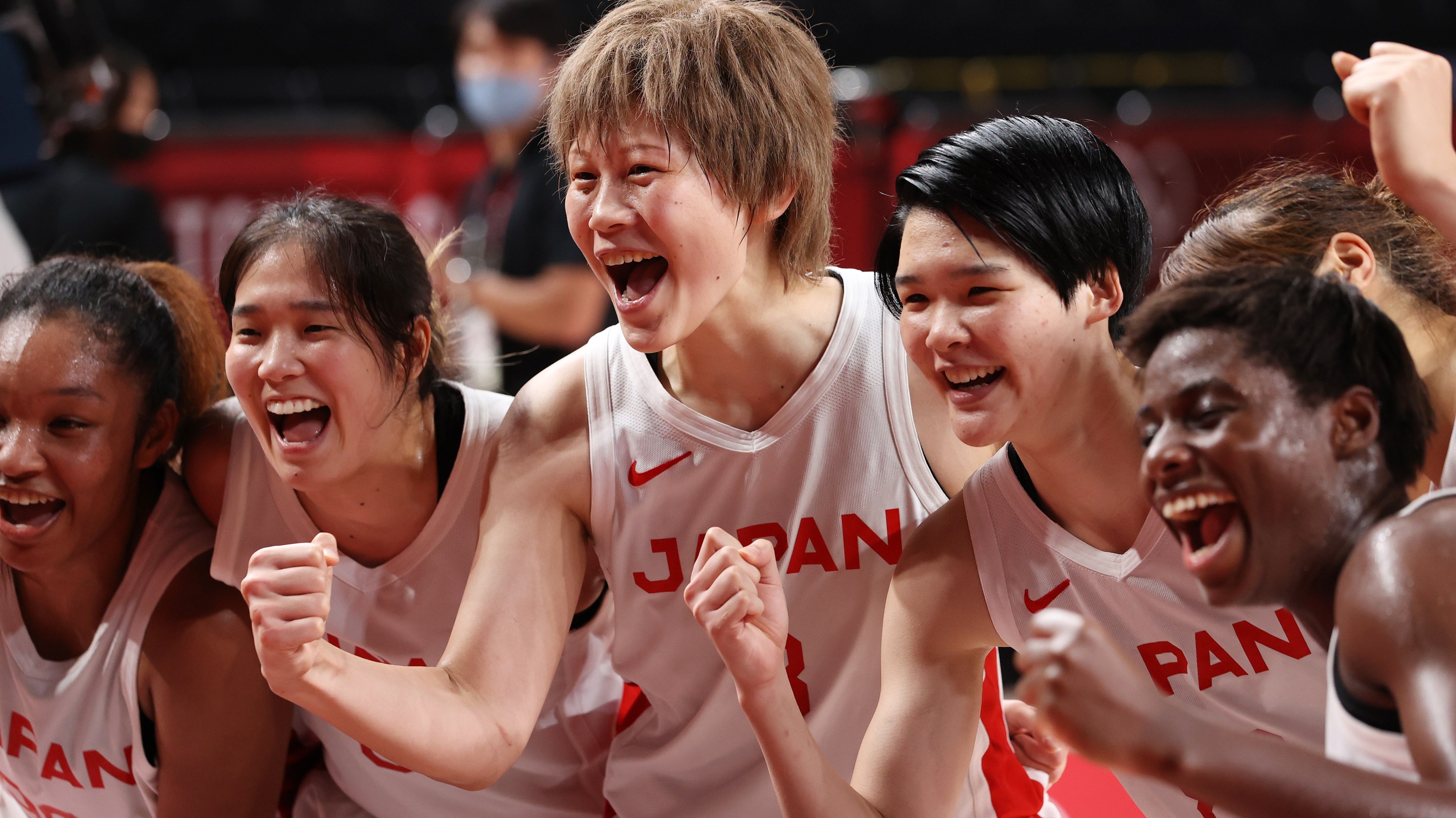 Team Japan celebrates their win in a Women's Basketball Semifinals game against France on day fourteen of the Tokyo 2020 Olympic Games at Saitama Super Arena on August 06, 2021 in Saitama, Japan.