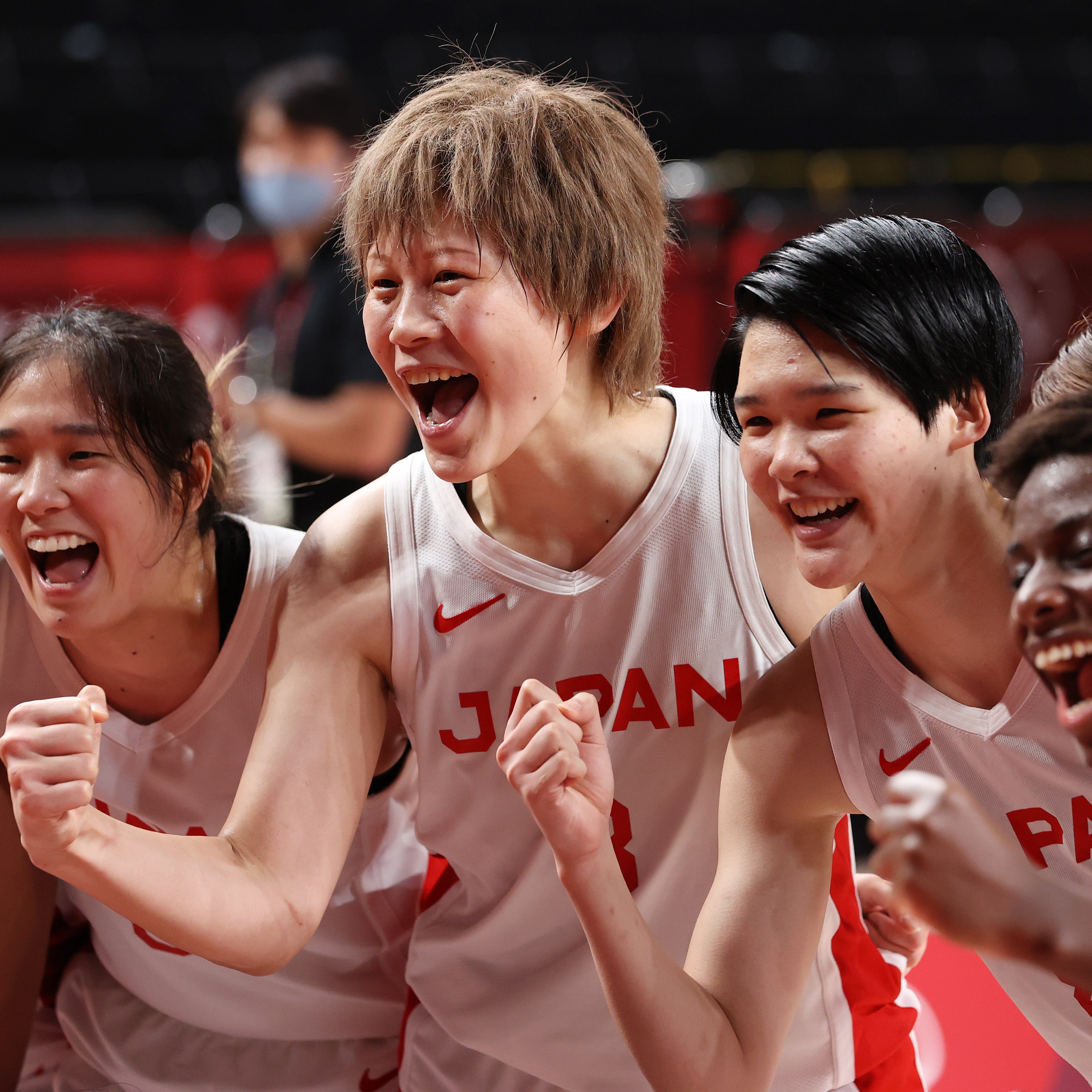 Team Japan celebrates their win in a Women's Basketball Semifinals game against France on day fourteen of the Tokyo 2020 Olympic Games at Saitama Super Arena on August 06, 2021 in Saitama, Japan.