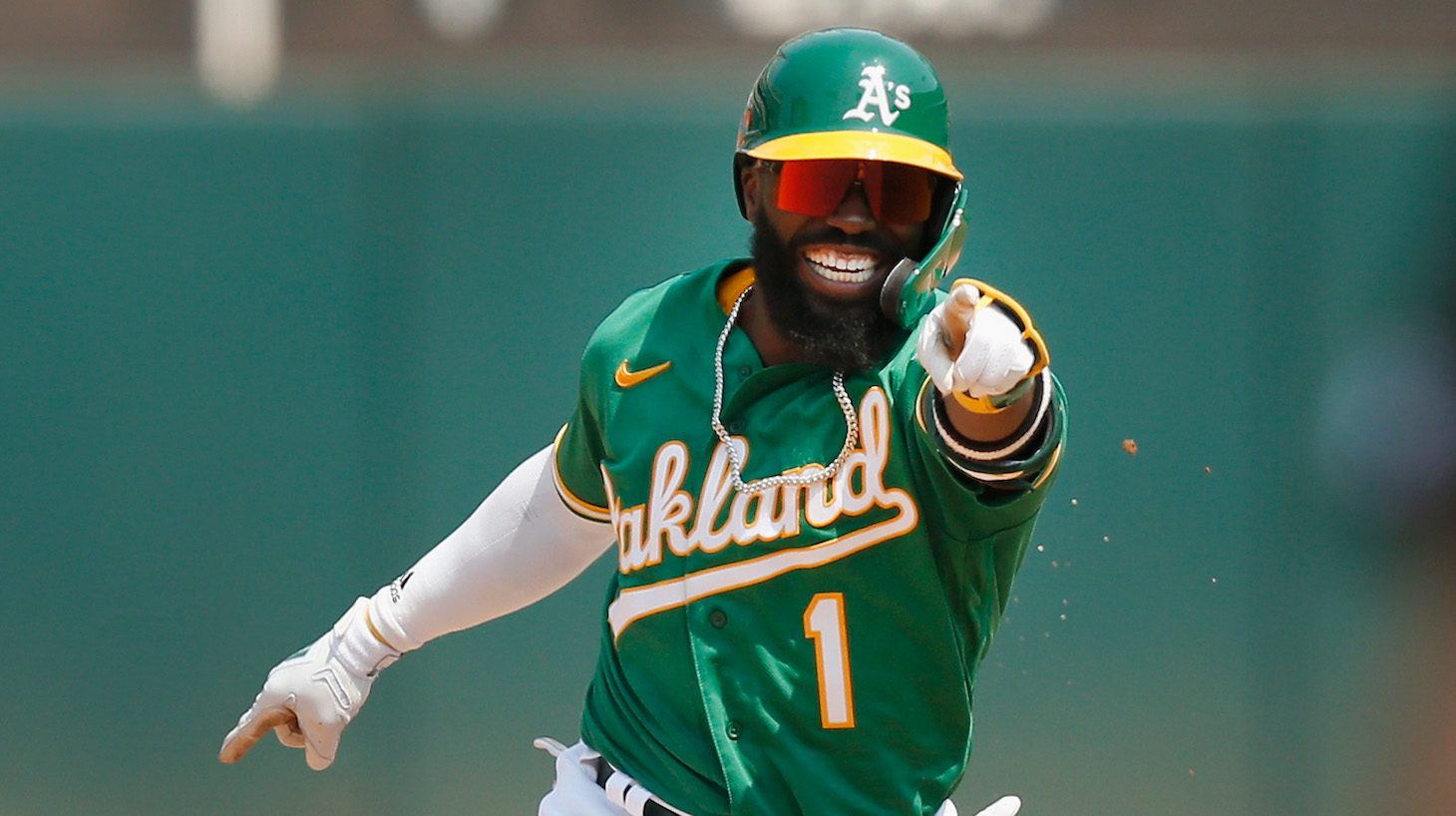 OAKLAND, CALIFORNIA - AUGUST 07: Josh Harrison #1 of the Oakland Athletics celebrates after hitting a two-run home run in the bottom of the fifth inning against the Texas Rangers at RingCentral Coliseum on August 07, 2021 in Oakland, California. (Photo by Lachlan Cunningham/Getty Images)