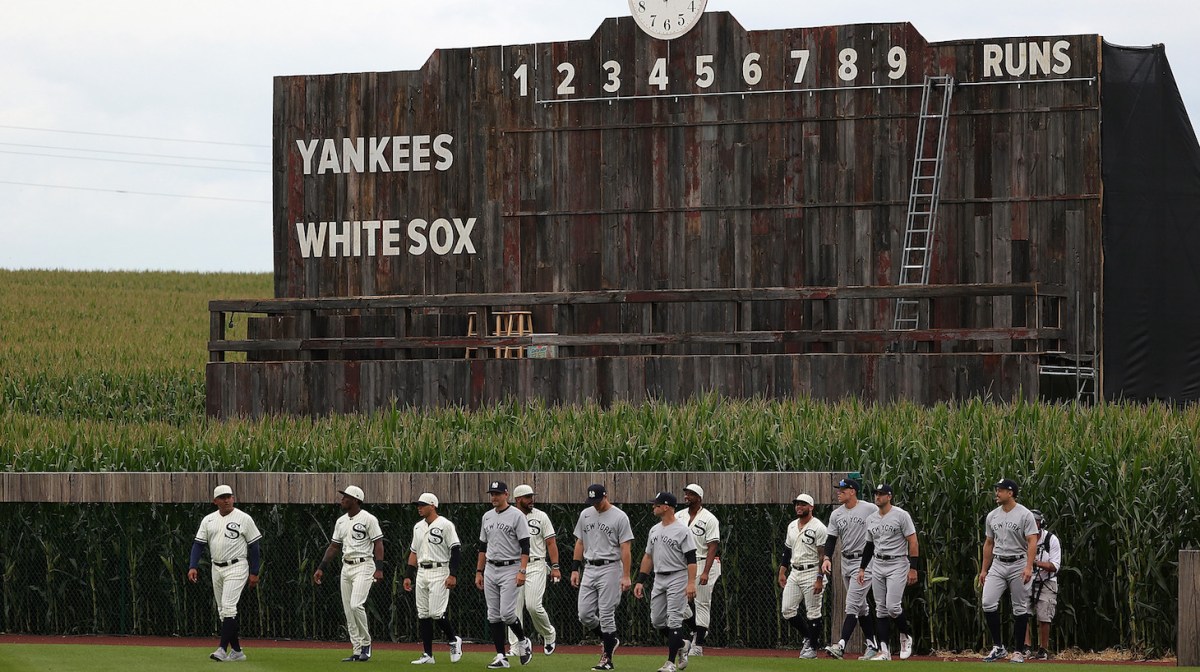 DYERSVILLE, IOWA - AUGUST 12: Members of the Chicago White Sox and the New York Yankees take the field prior to a game at the Field of Dreams on August 12, 2021 in Dyersville, Iowa. (Photo by Stacy Revere/Getty Images)