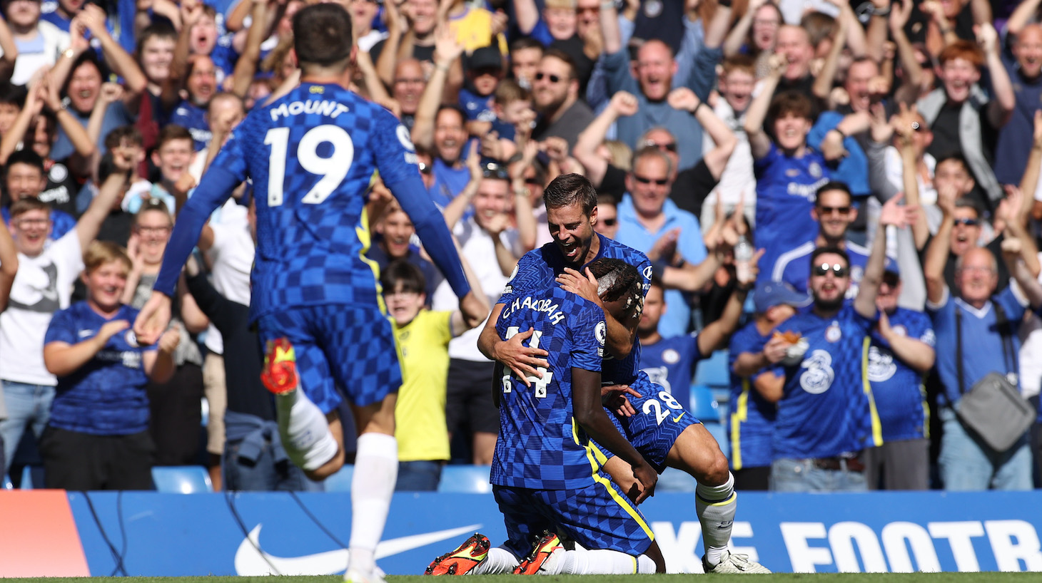 Trevoh Chalobah of Chelsea celebrates with teammate Cesar Azpilicueta after scoring their side's third goal during the Premier League match between Chelsea and Crystal Palace at Stamford Bridge on August 14, 2021 in London, England.