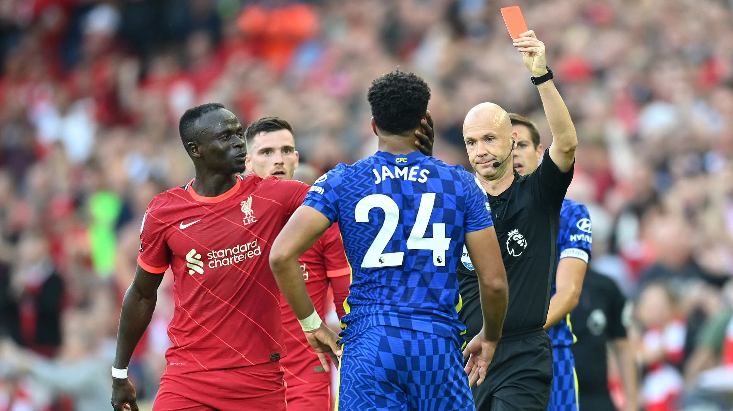 Reece James of Chelsea is shown a Red Card by Match Referee Anthony Taylor during the Premier League match between Liverpool and Chelsea at Anfield on August 28, 2021 in Liverpool, England.