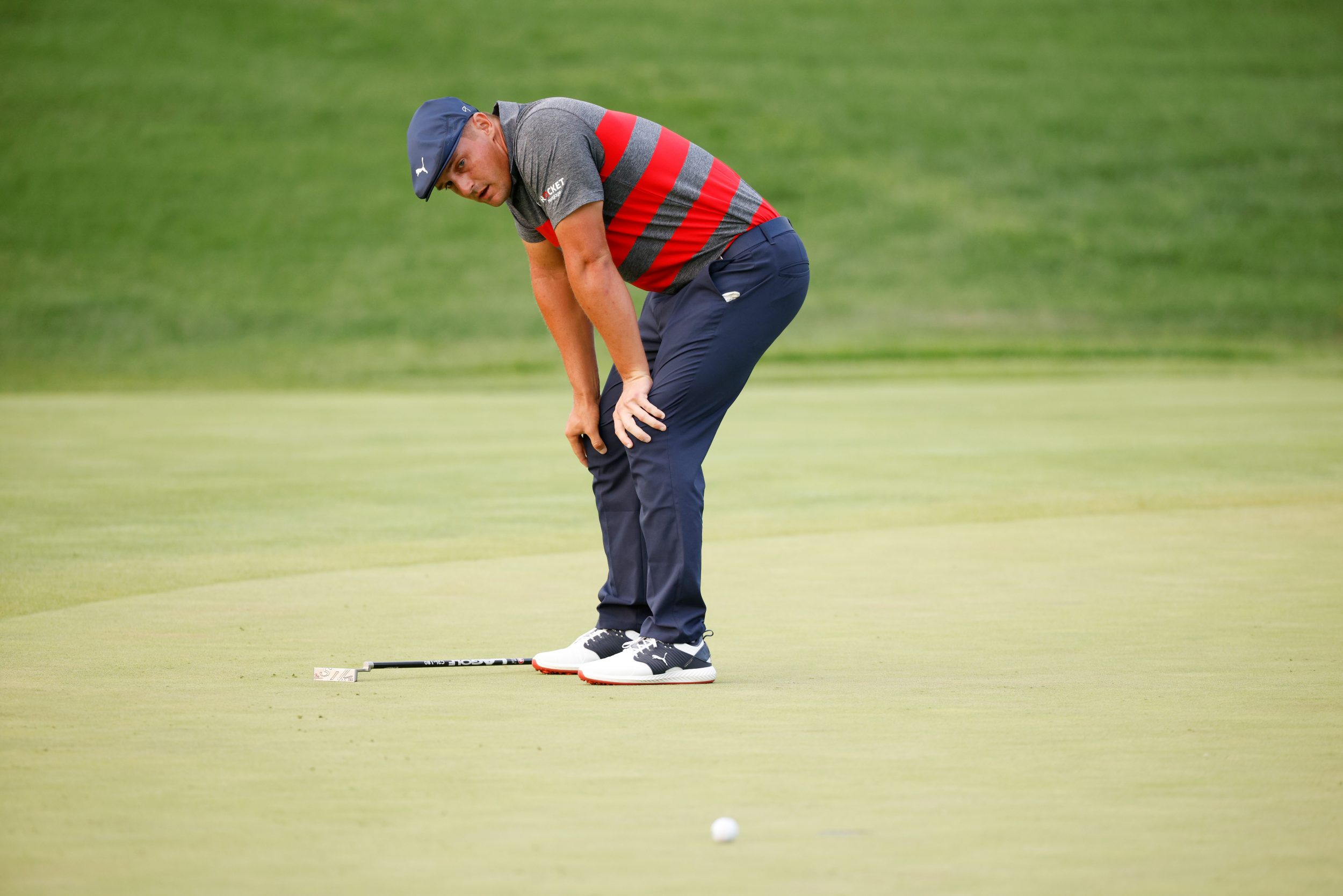 Bryson DeChambeau looks bummed about a missed putt.