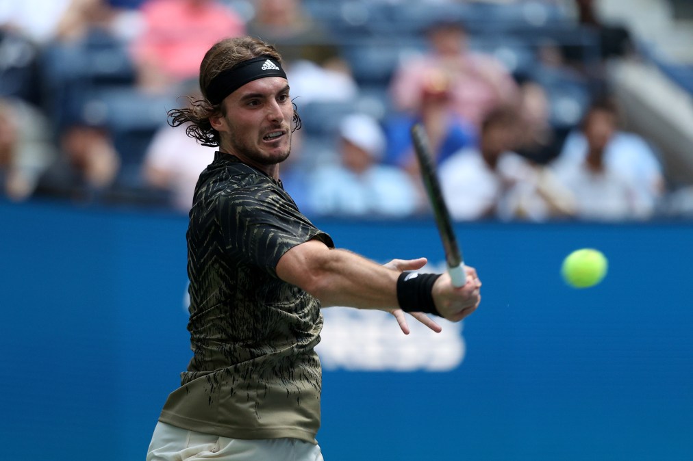 NEW YORK, NEW YORK - AUGUST 30: Stefanos Tsitsipas of Greece returns a shot against Andy Murray of United Kingdom during their men's singles first round match on Day One of the 2021 US Open at the Billie Jean King National Tennis Center on August 30, 2021 in the Flushing neighborhood of the Queens borough of New York City. (Photo by Elsa/Getty Images)