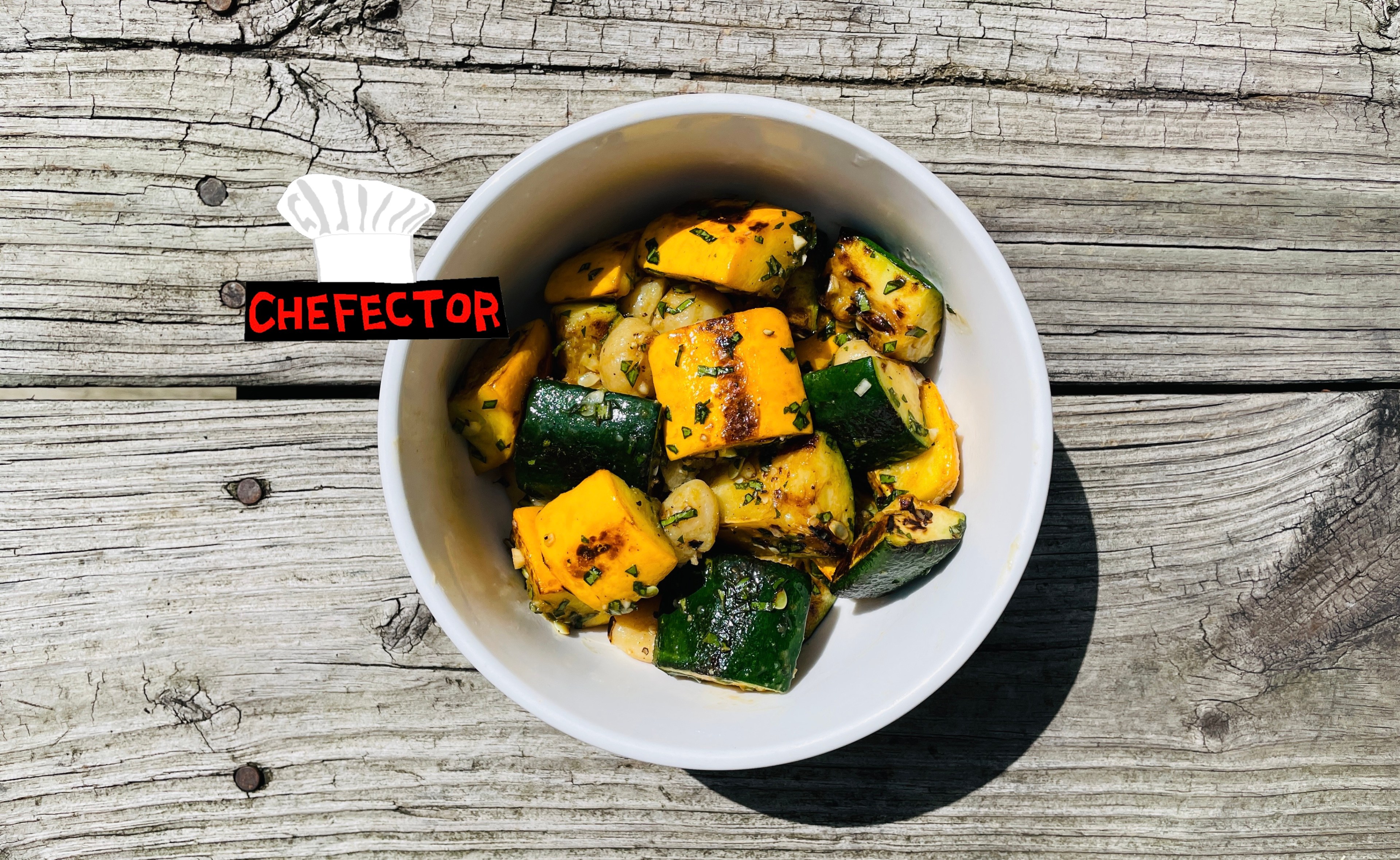 A bowl of squash with gnocchi and basil