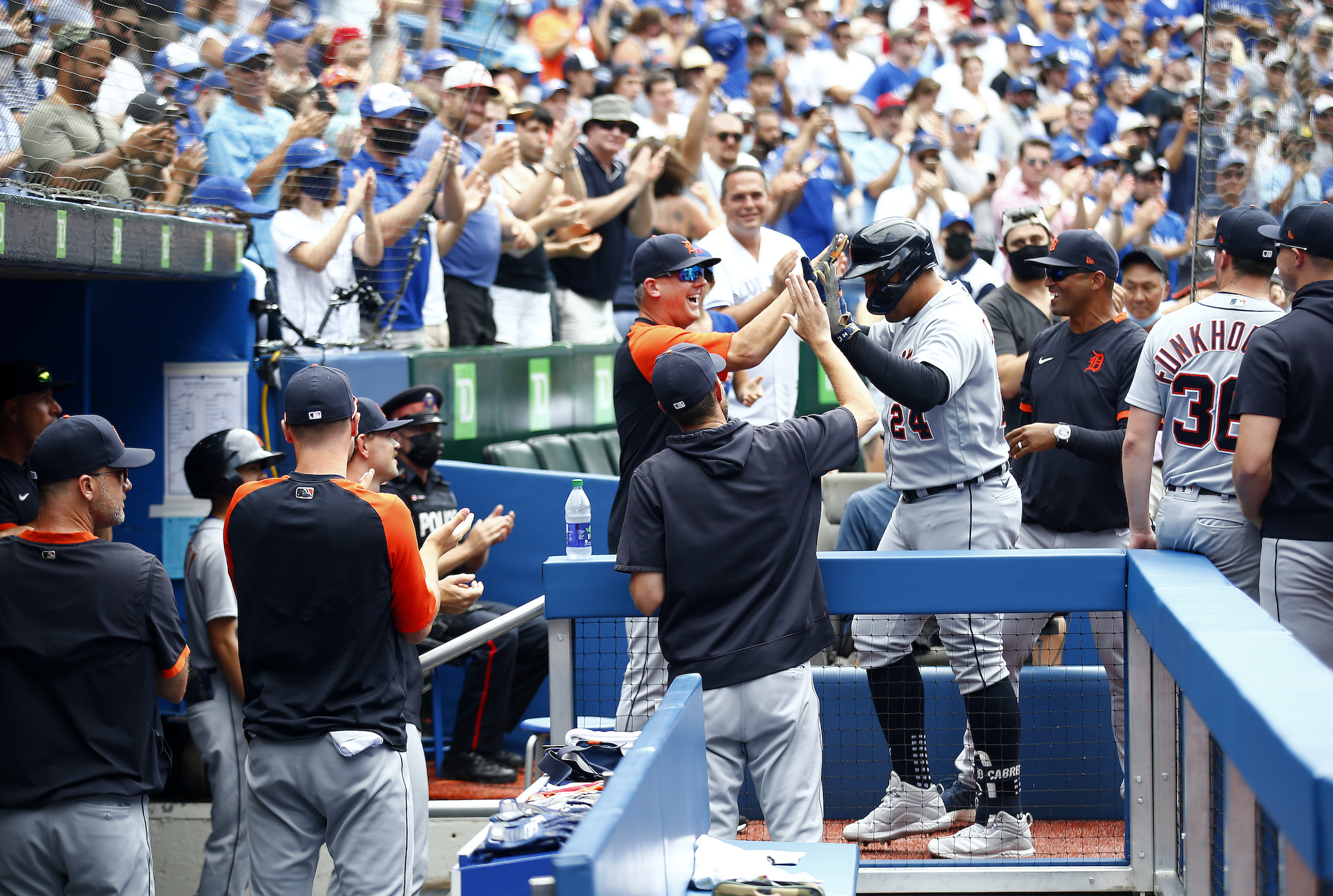 Miguel Cabrera #24 of the Detroit Tigers high fives Manager A.J. Hinch after hitting his 500th career home run in the sixth inning during a MLB game against the Toronto Blue Jays at Rogers Centre on August 22, 2021 in Toronto, Ontario, Canada.