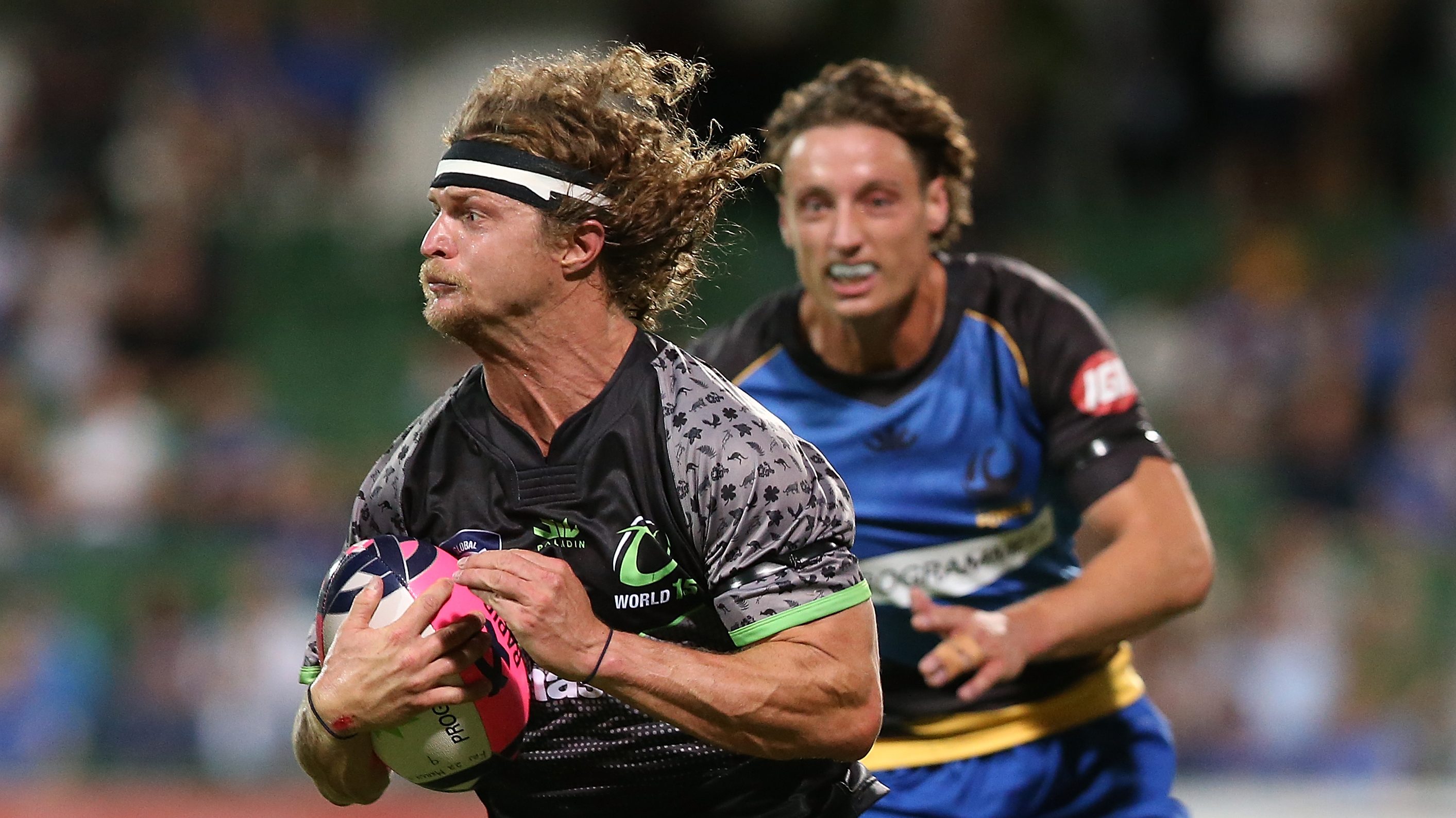 Nick Cummins, Australian rugby guy, runs with the ball in 2019