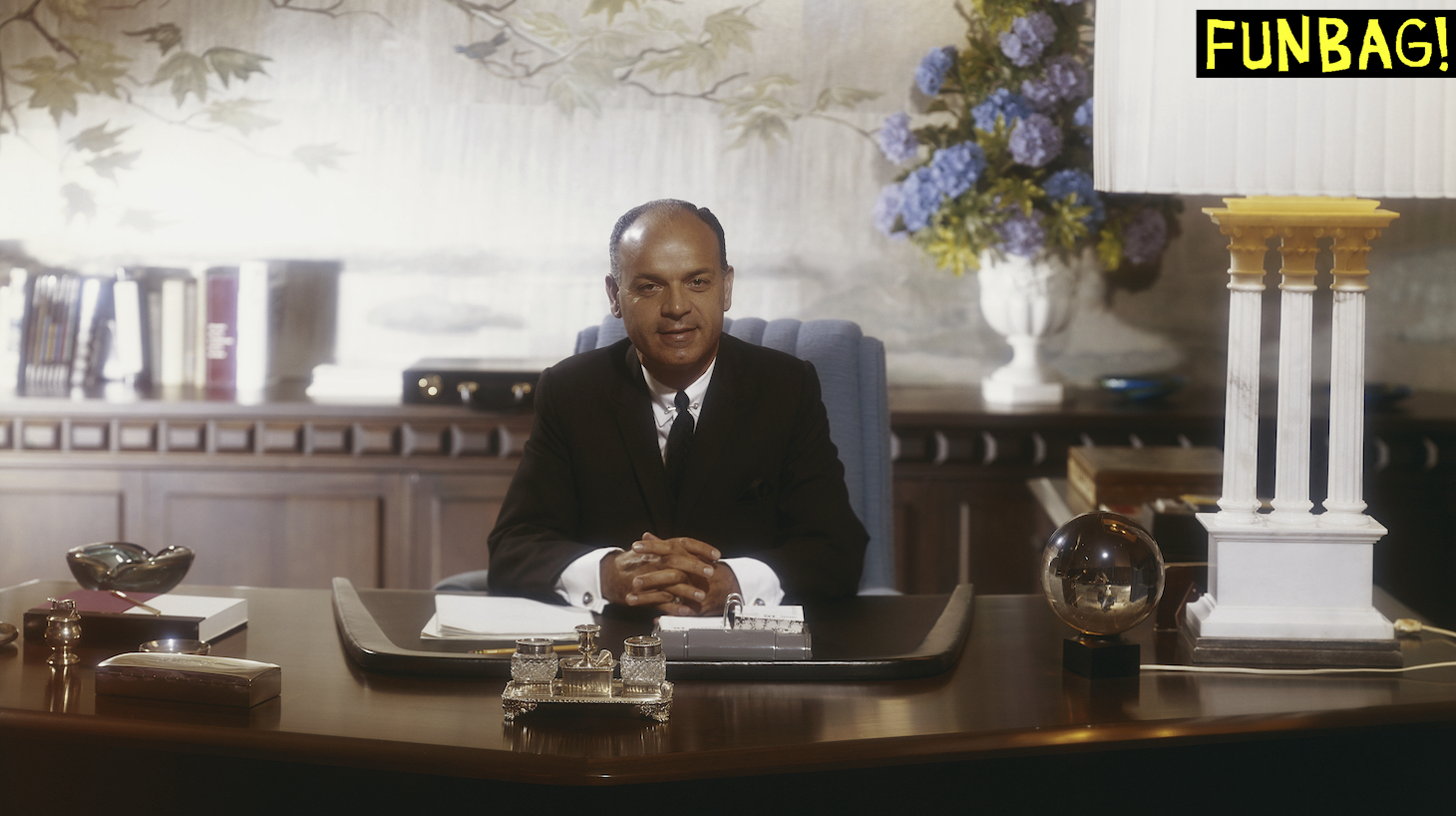 Businessman sitting in office, portrait